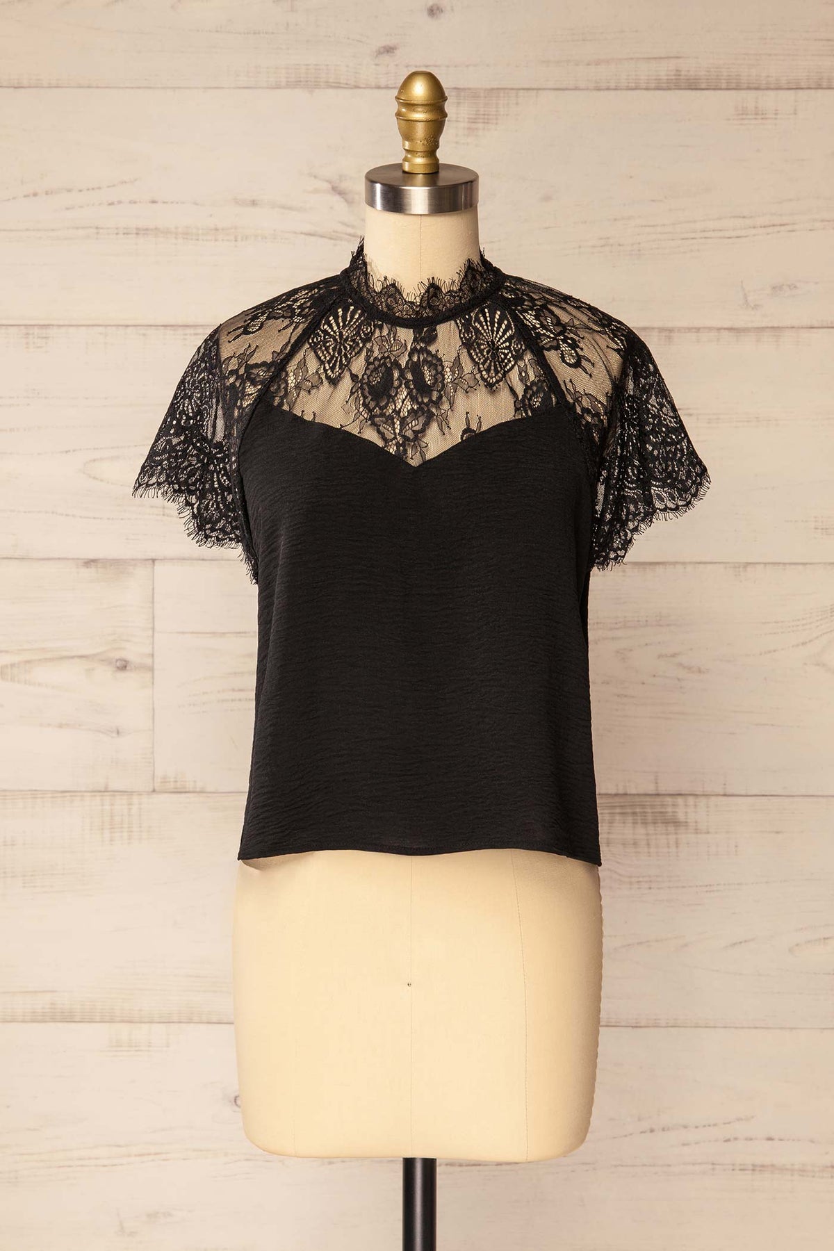 front view of Aksu Black Lace Yoke High-Neck Short Sleeve Top at La petite garçonne