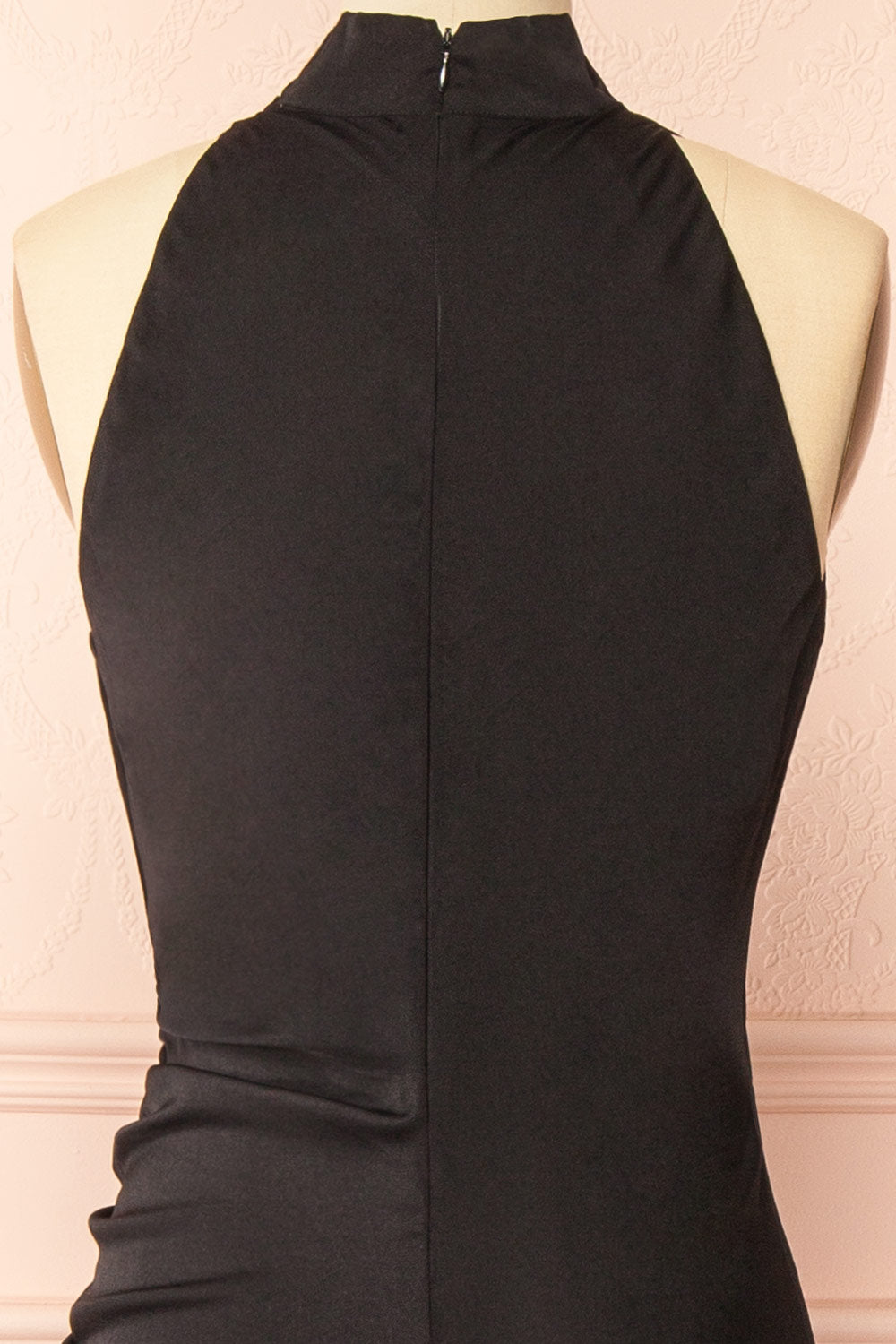 back of a sewing mannequin wearing the Alberta Black Maxi Dress with a high neckline from Boutique 1861.