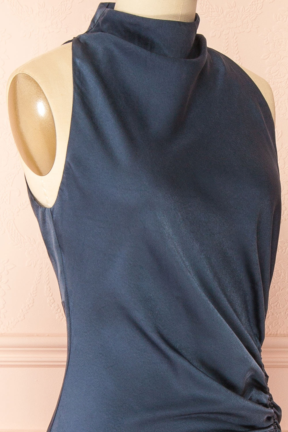 side of a sewing mannequin wearing the Alberta Navy Maxi Dress with a high neckline from Boutique 1861
