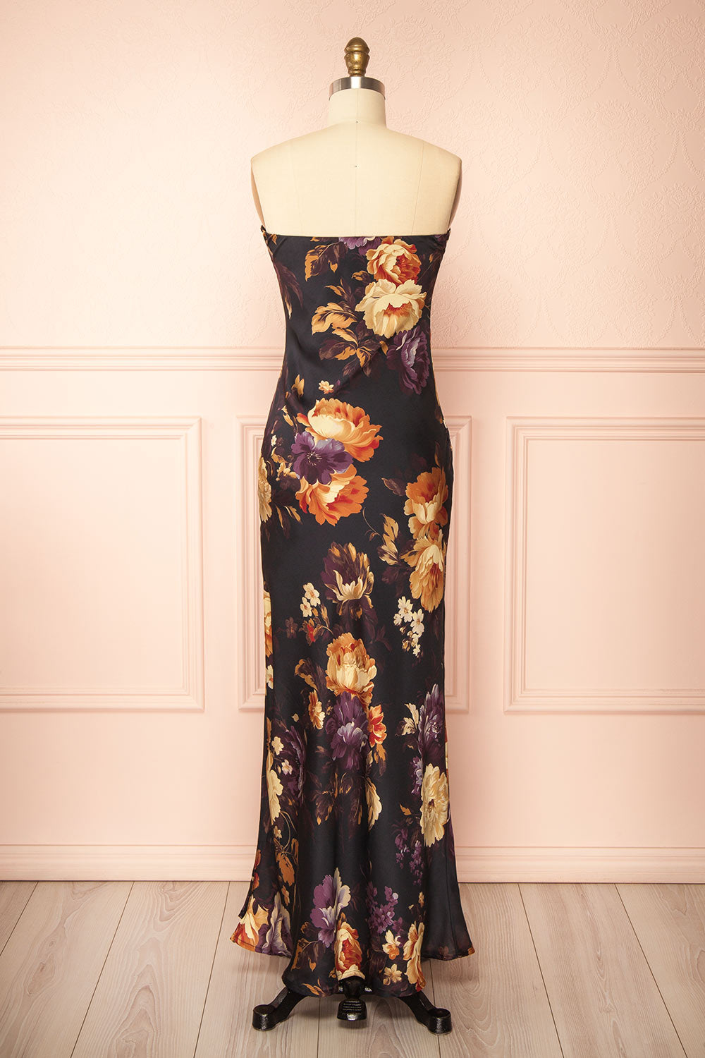 back view of a mannequin wearing the Aleana Floral Satin Strapless Dress from boutique 1861