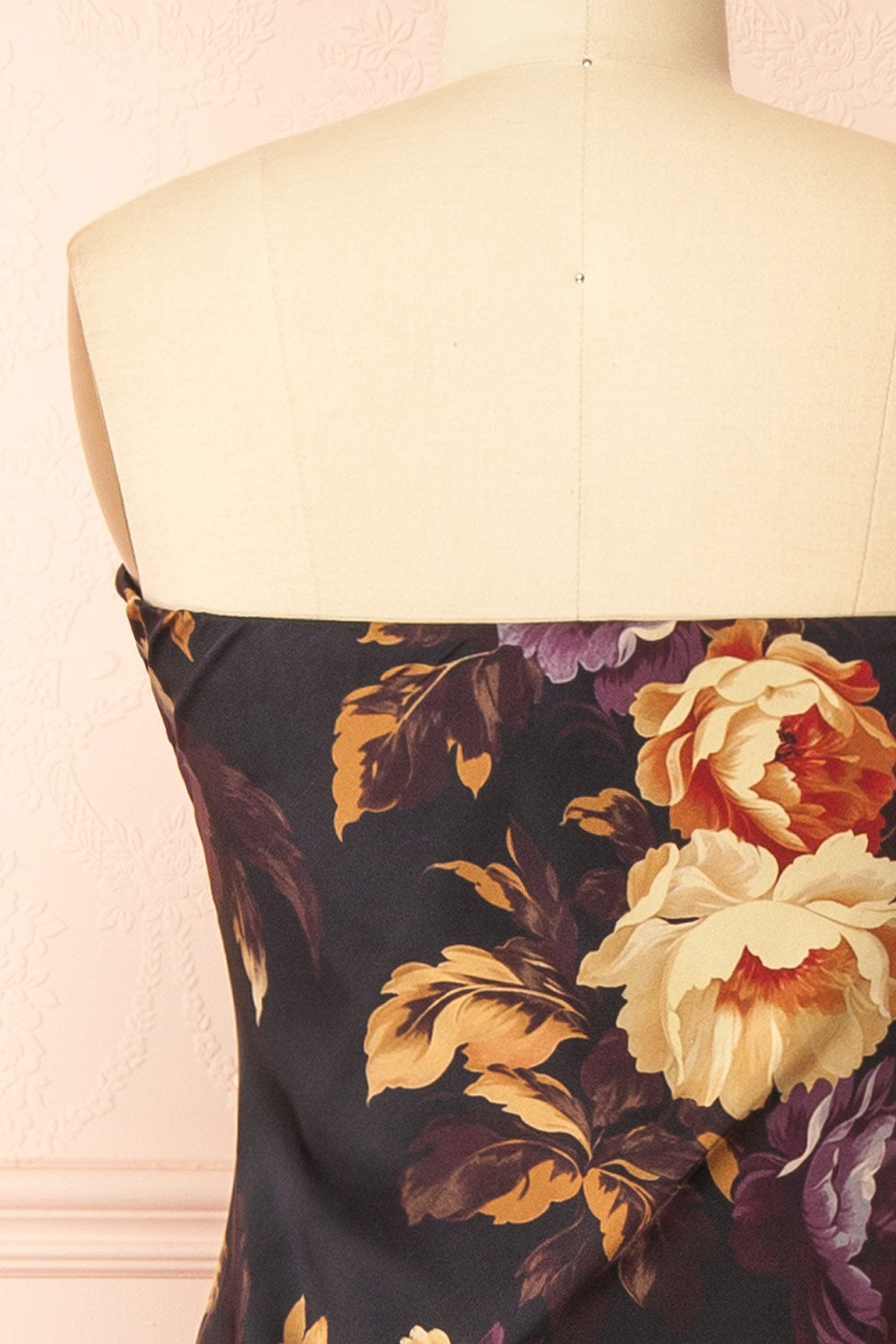 back of a mannequin wearing the Aleana Floral Satin Strapless Dress from boutique 1861