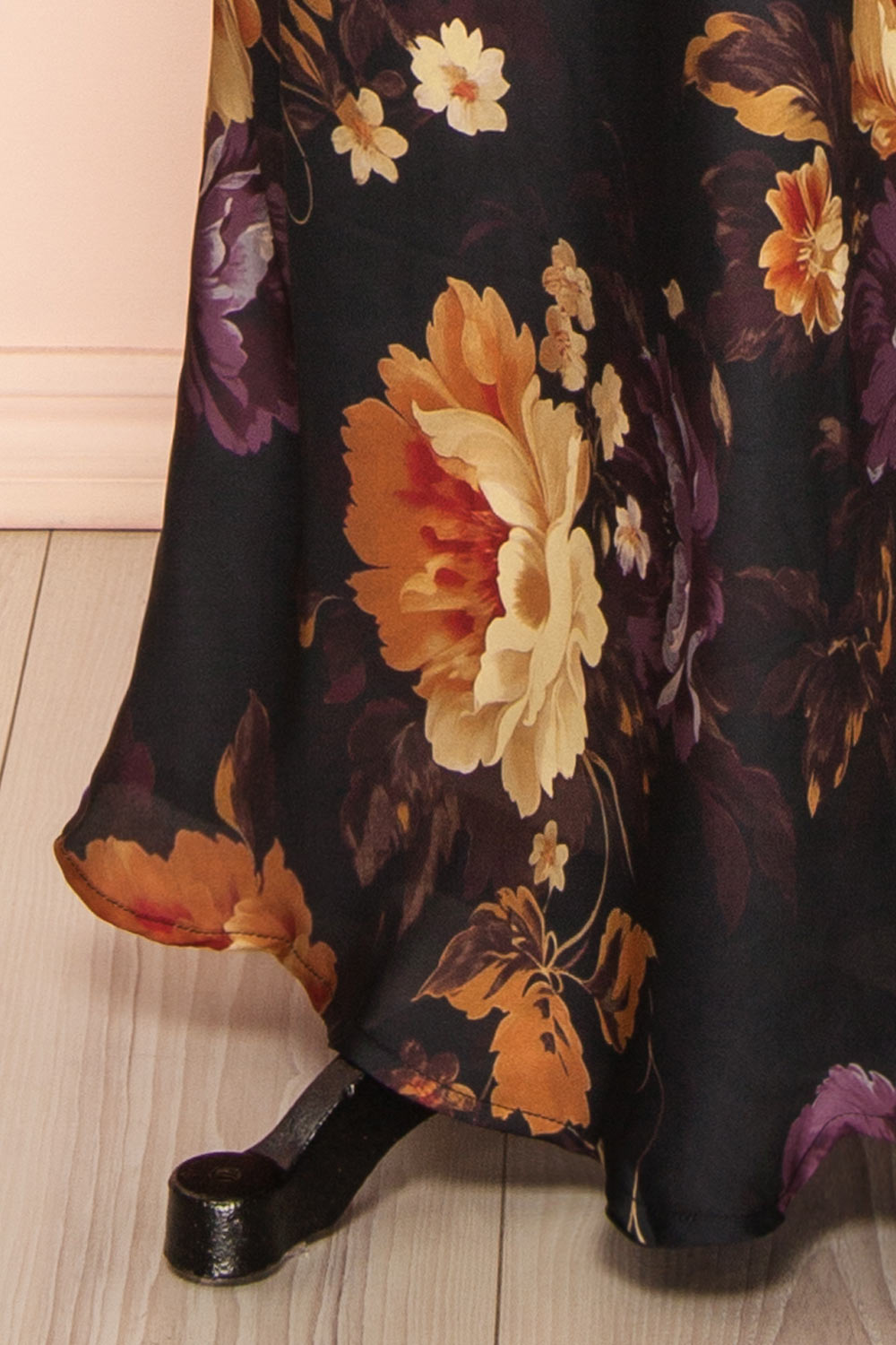 bottom of a mannequin wearing the Aleana Floral Satin Strapless Dress from boutique 1861