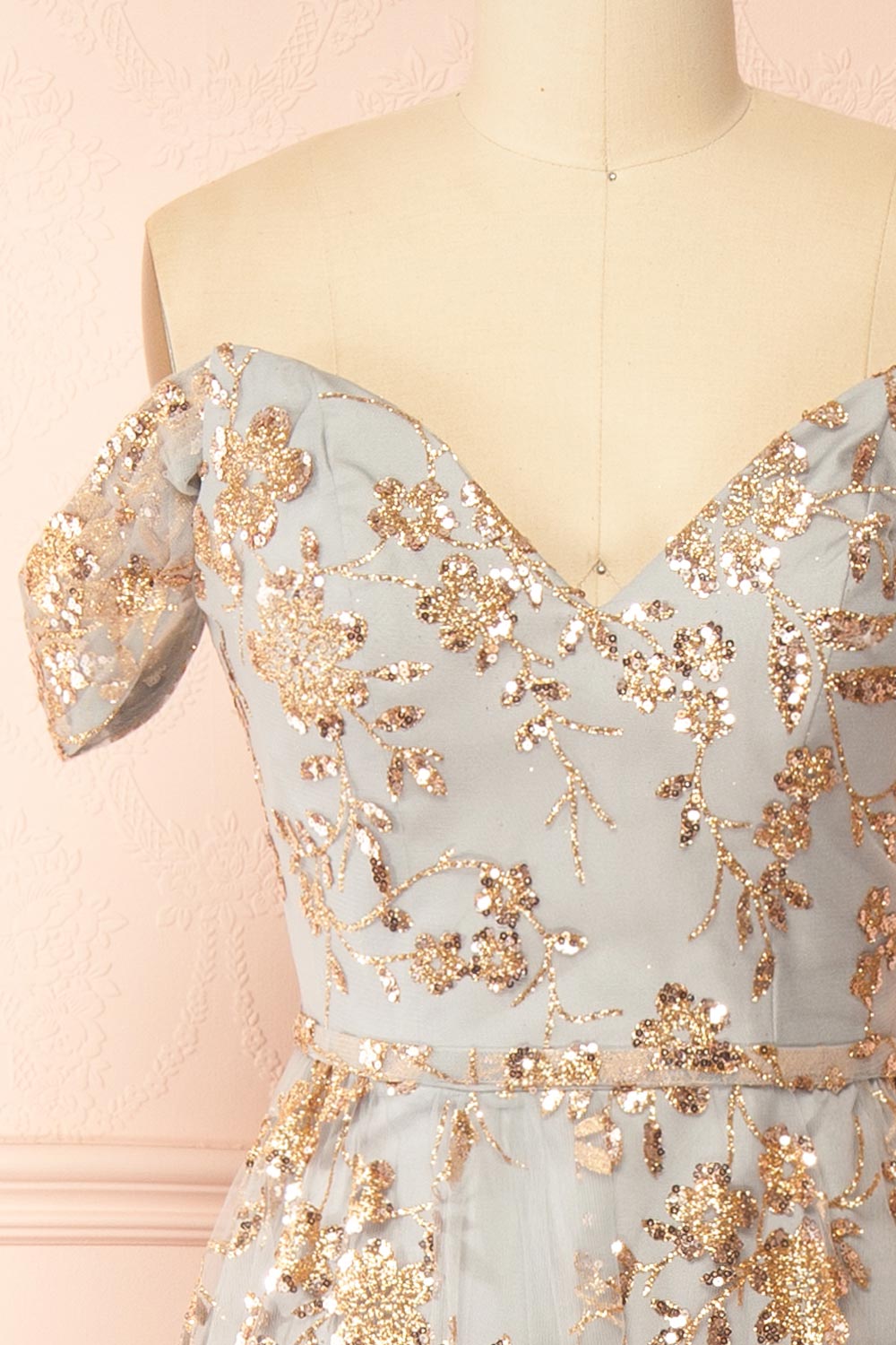 front of sewing mannequin wearing Alienor Grey Glittery Off the Shoulder Maxi Dress from Boutique 1861