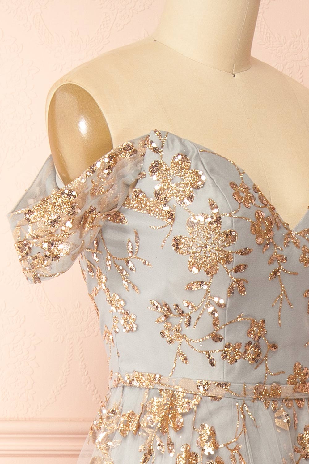 side of sewing mannequin wearing Alienor Grey Glittery Off the Shoulder Maxi Dress from Boutique 1861