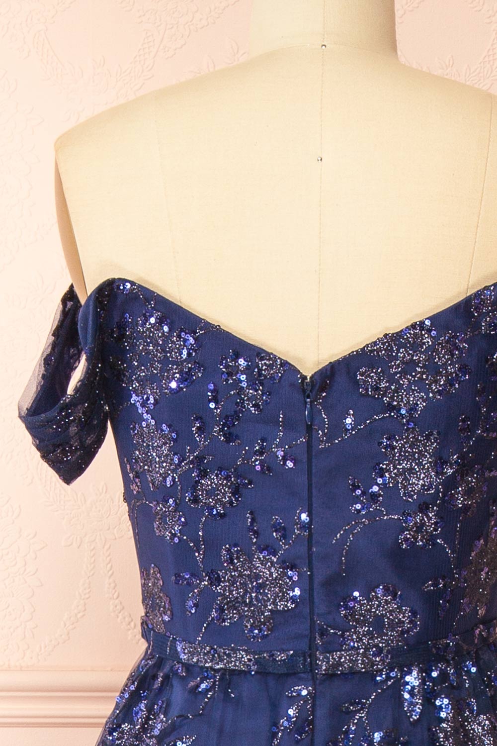 back of sewing mannequin wearing Alienor navy Glittery Off the Shoulder Maxi Dress from Boutique 1861