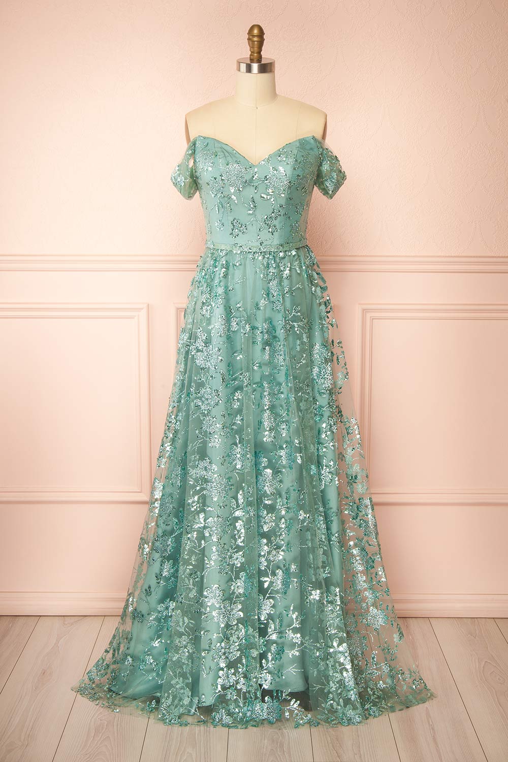 front view of sewing mannequin wearing Alienor Teal Glittery Off the Shoulder Maxi Dress from Boutique 1861