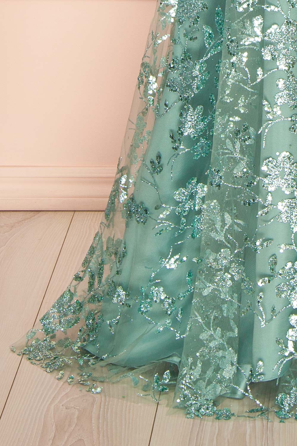 bottom of sewing mannequin wearing Alienor Teal Glittery Off the Shoulder Maxi Dress from Boutique 1861