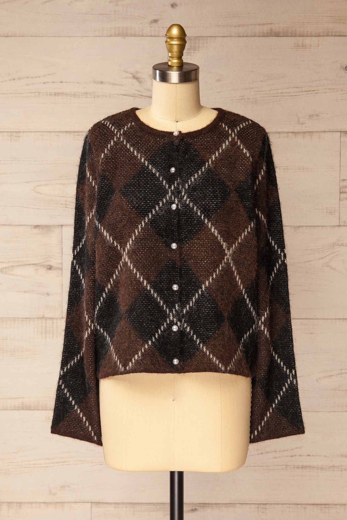 front view of Amqui Brown Argyle Knit Pearl Button Cardigan at La petite garçonne