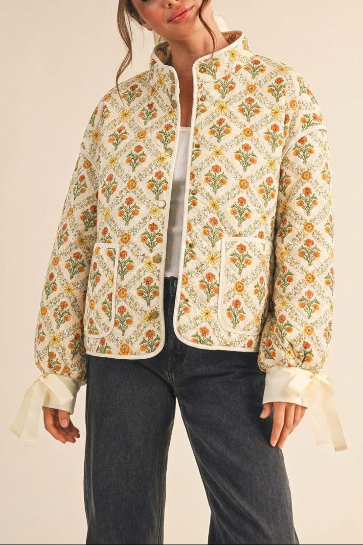 woman wearing Anabeth Orange Floral Quilted Jacket with Ribbon-Tied from Boutique 1861