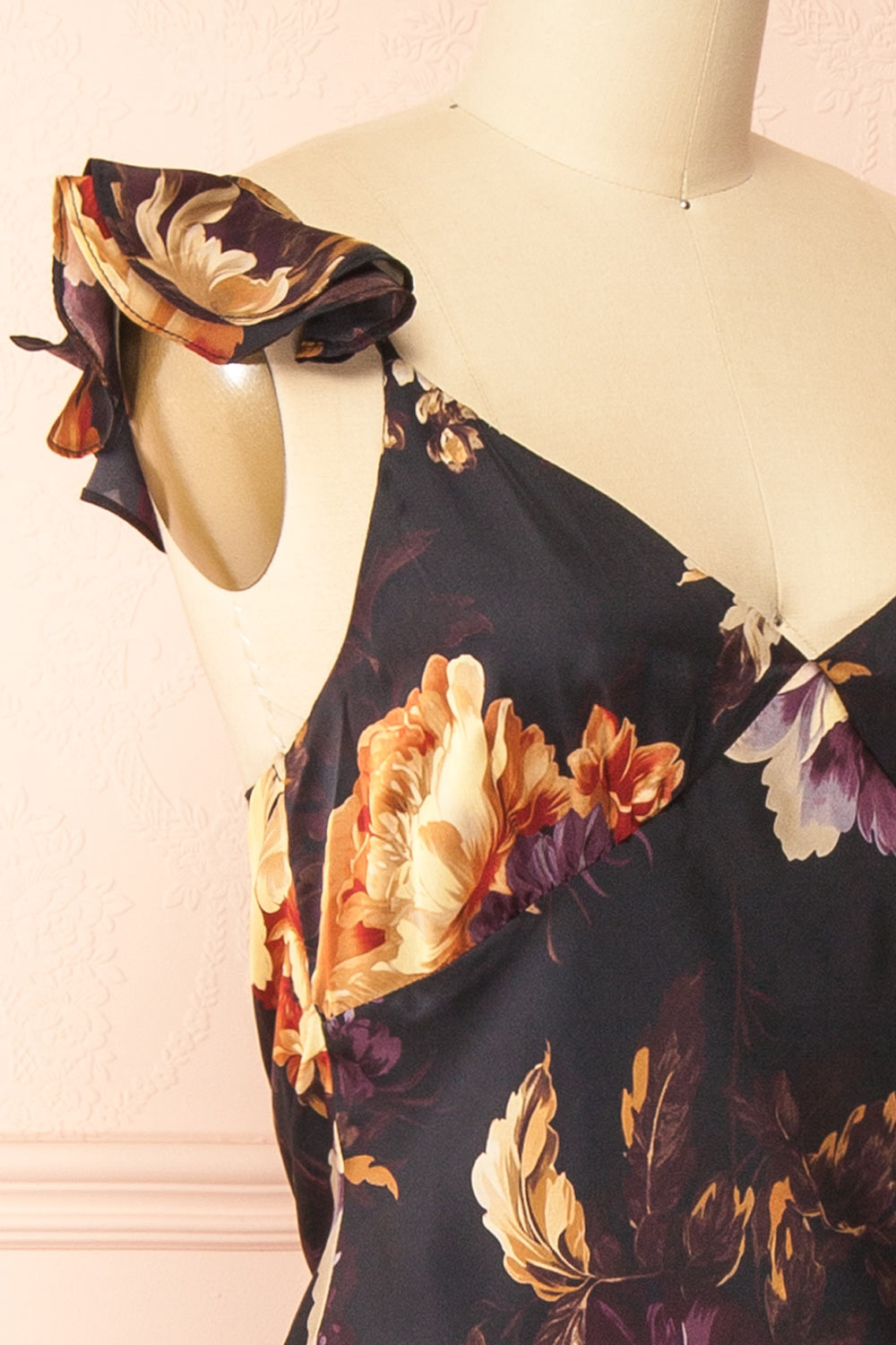 side of a sewing mannequin wearing the Angella Floral Satin Dress from Boutique 1861