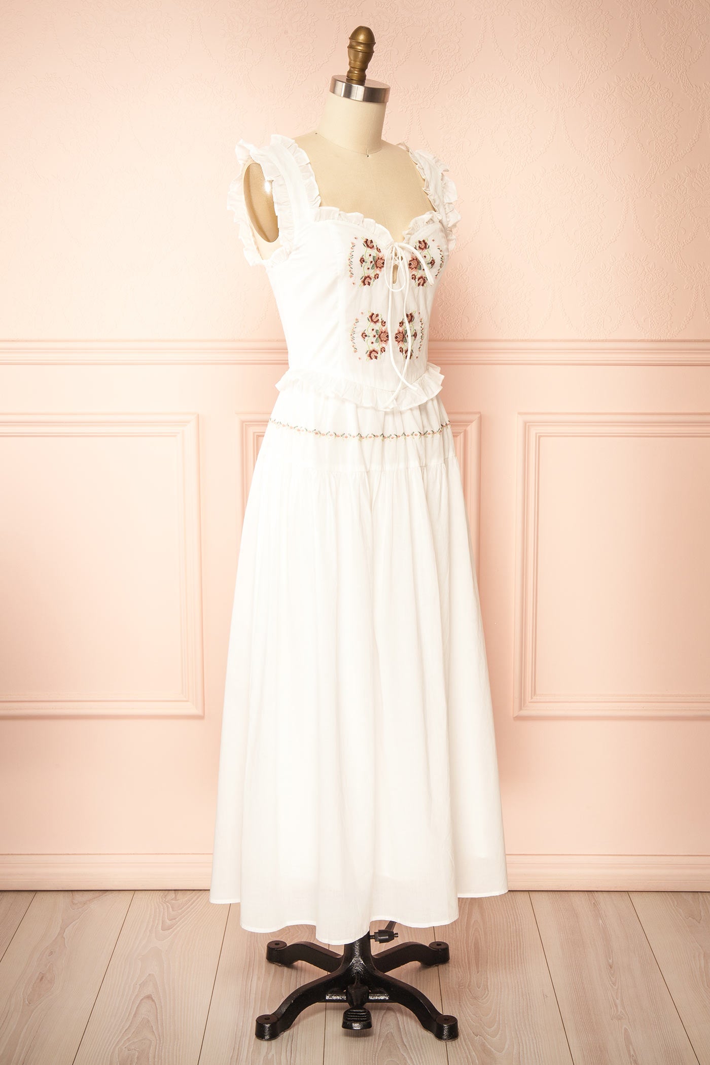 Profile view Aspyn White Floral Embroidered Midi Dress with Smocked Back at boutique 1861