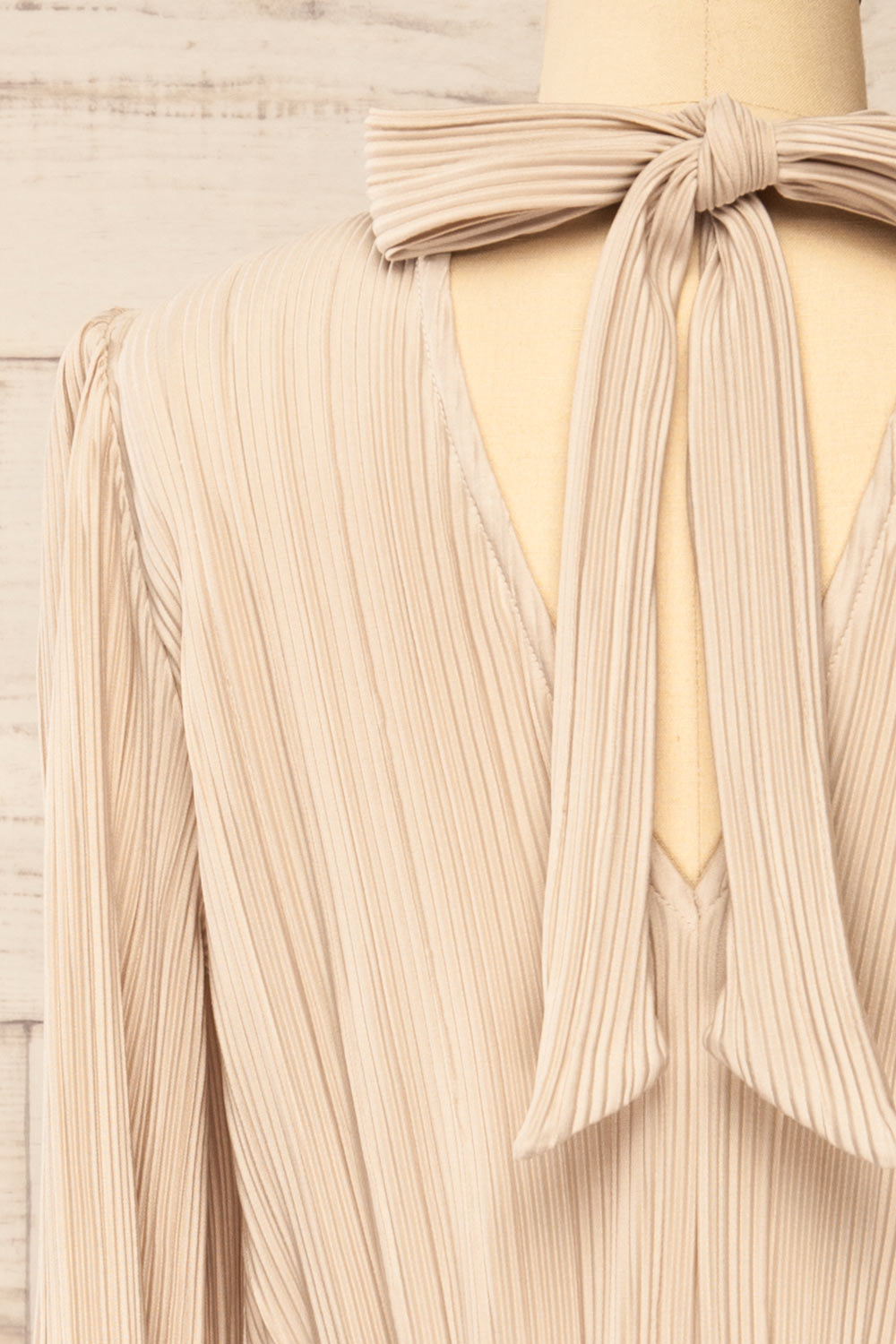 Atyrau Beige Short Pleated Dress w/ Long Sleeves | La petite garçonne back close-up