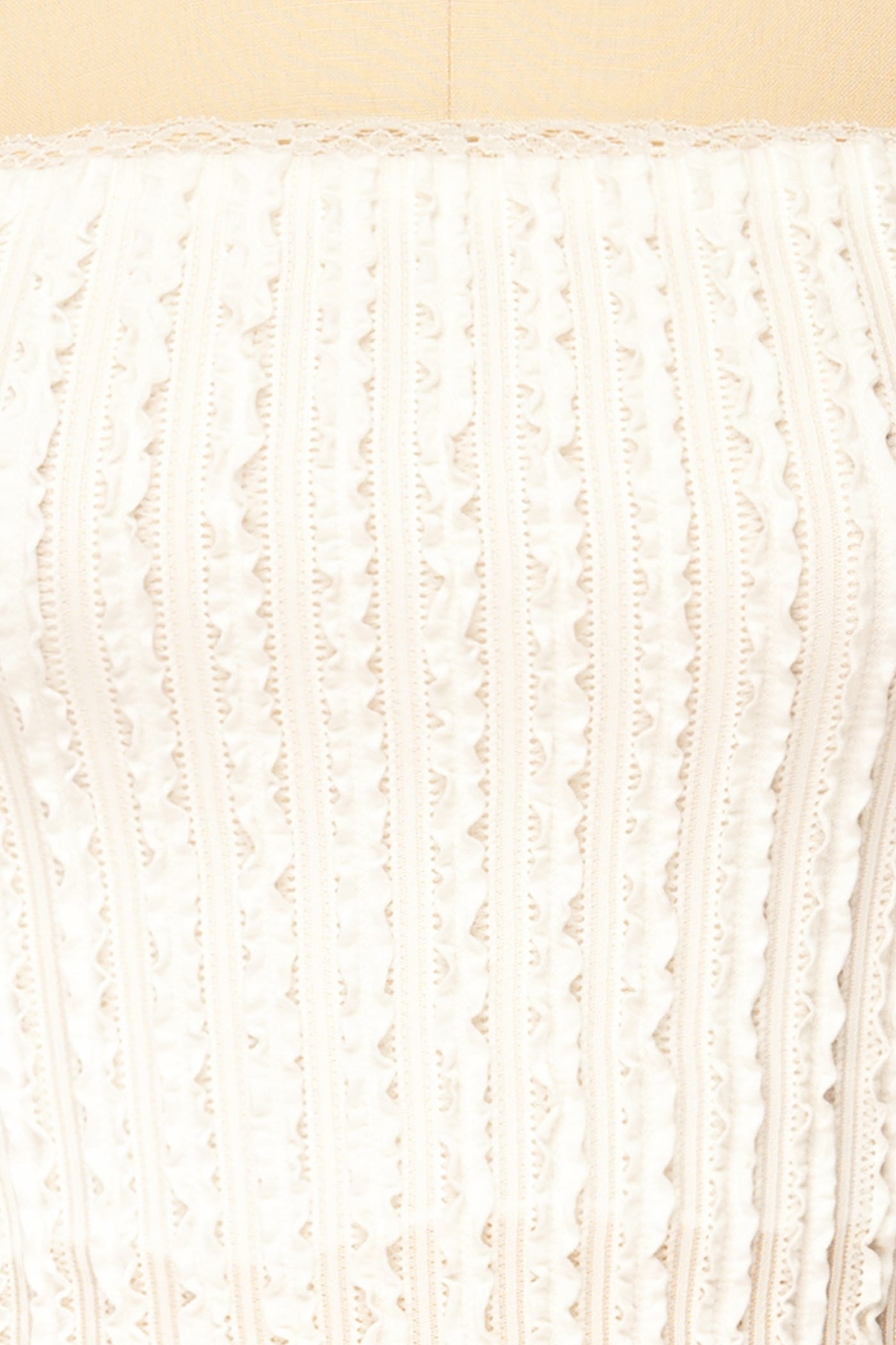 Close-up view Aureilly Ivory Textured Ruffle Bandeau Top at la petite garçonne