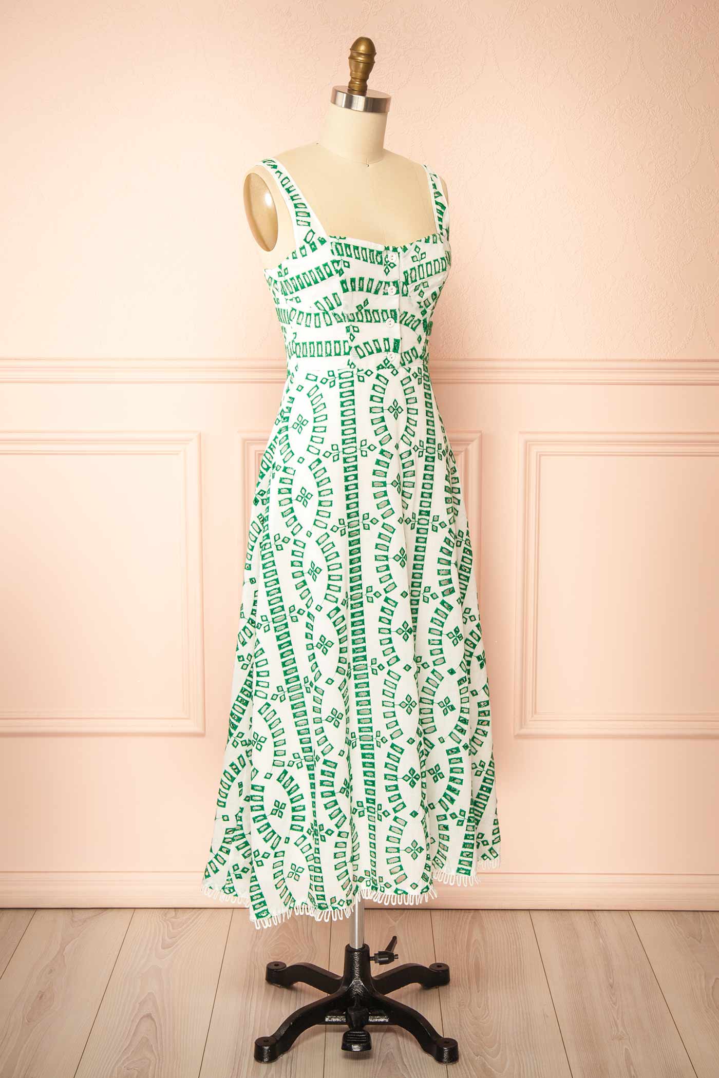 Sideview of Averil | Midi Dress with Geometric Embroidery on mannequin from boutique 1861