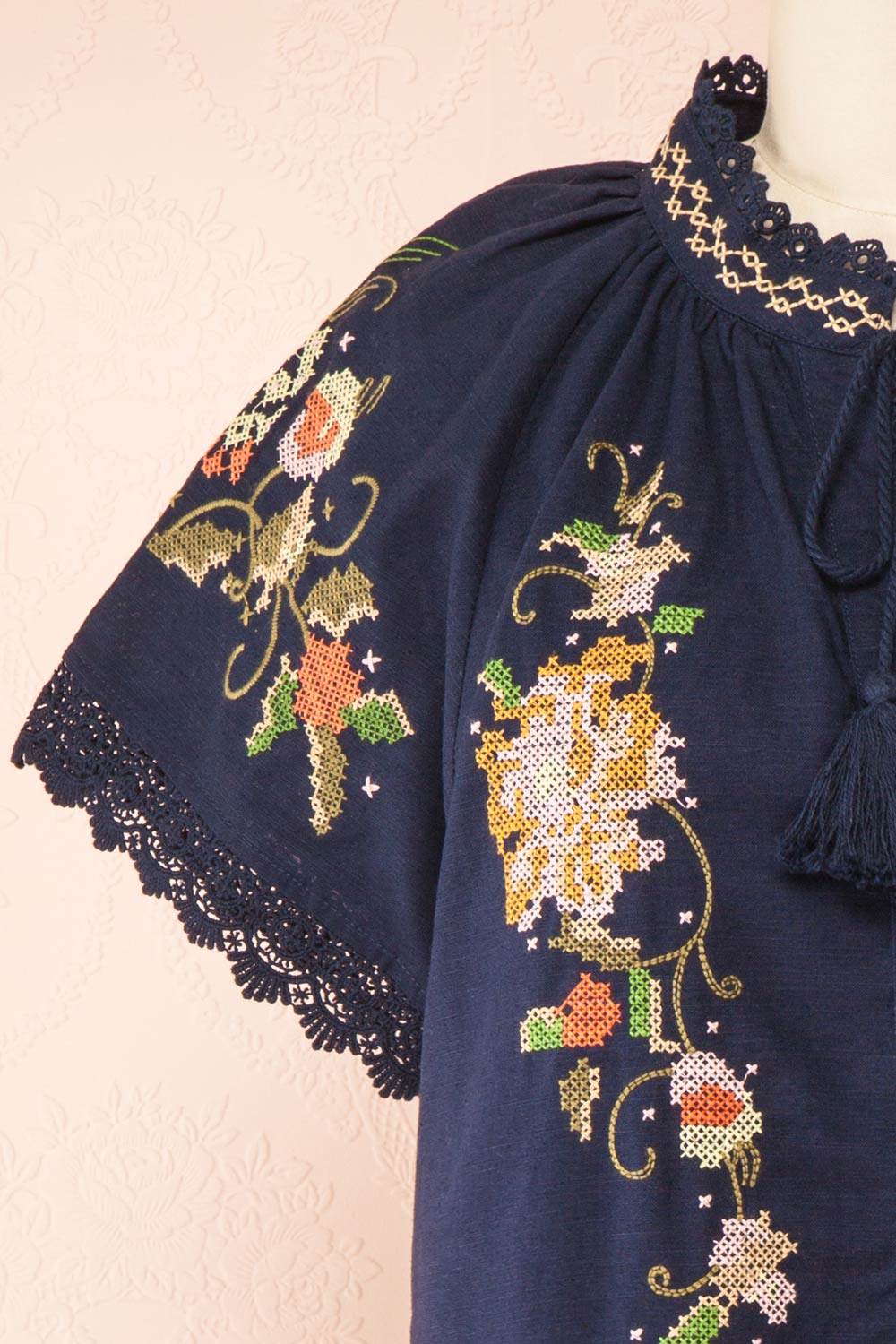 Avril Navy Romper with Floral Cross-Stitch | Boutique 1861 front