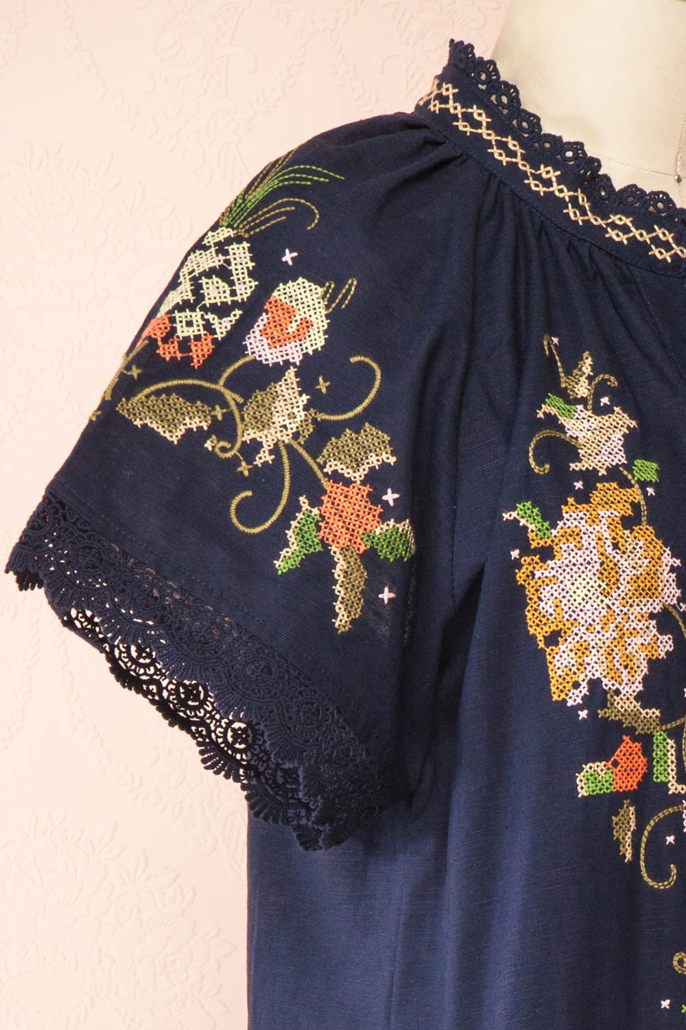 Avril Navy Romper with Floral Cross-Stitch | Boutique 1861 side