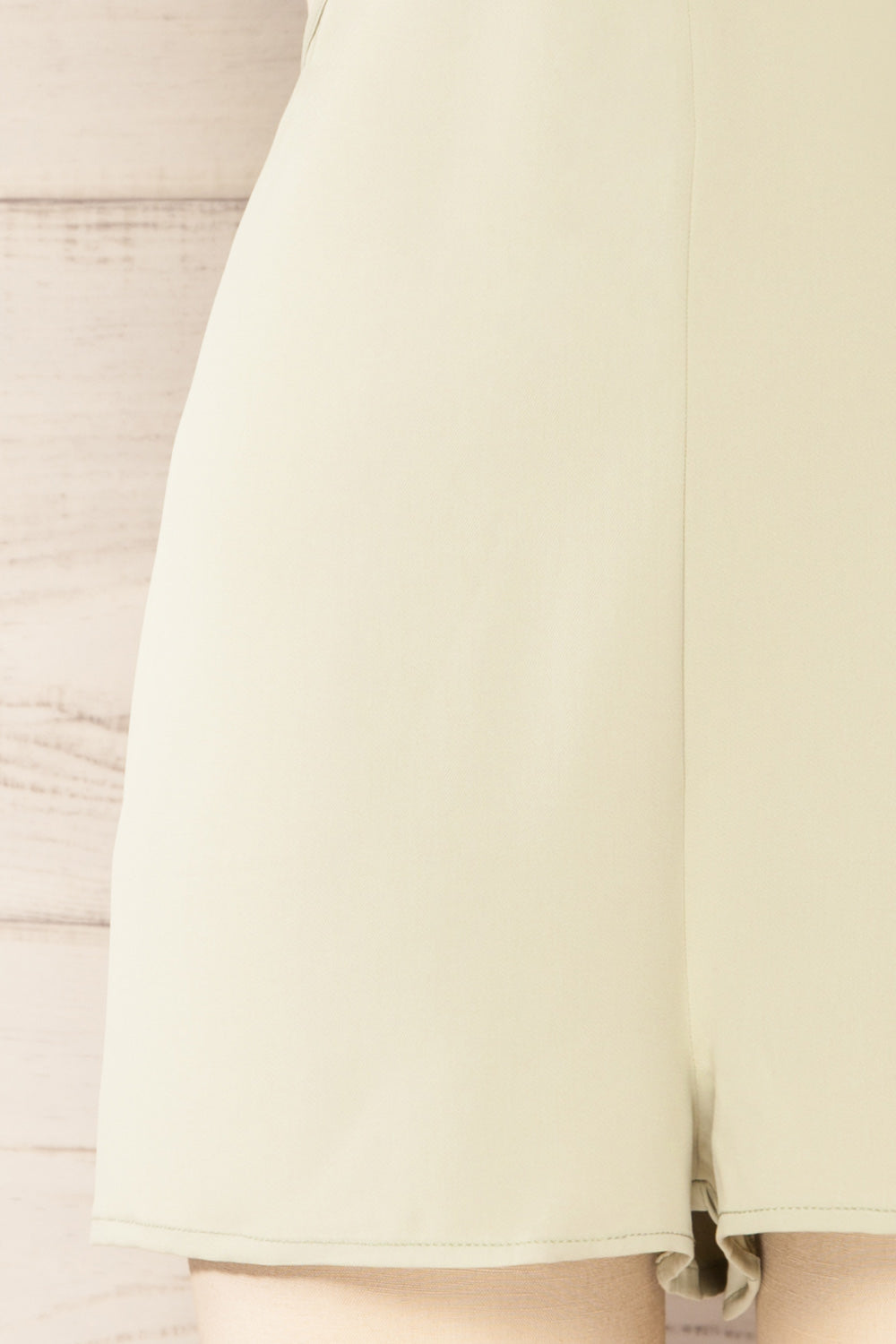 Balcarce Sage Romper w/ Cut-Outs | La petite garçonne bottom close-up