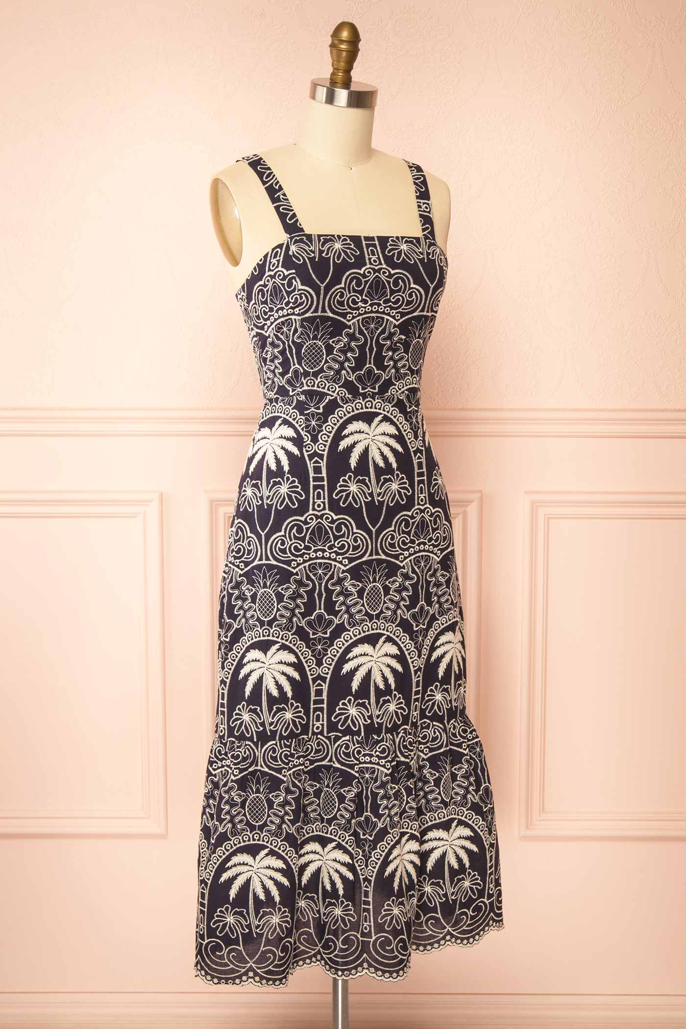 Sideview of Barasat Navy Midi Dress with Embroidery on a mannquin from boutique 1861.