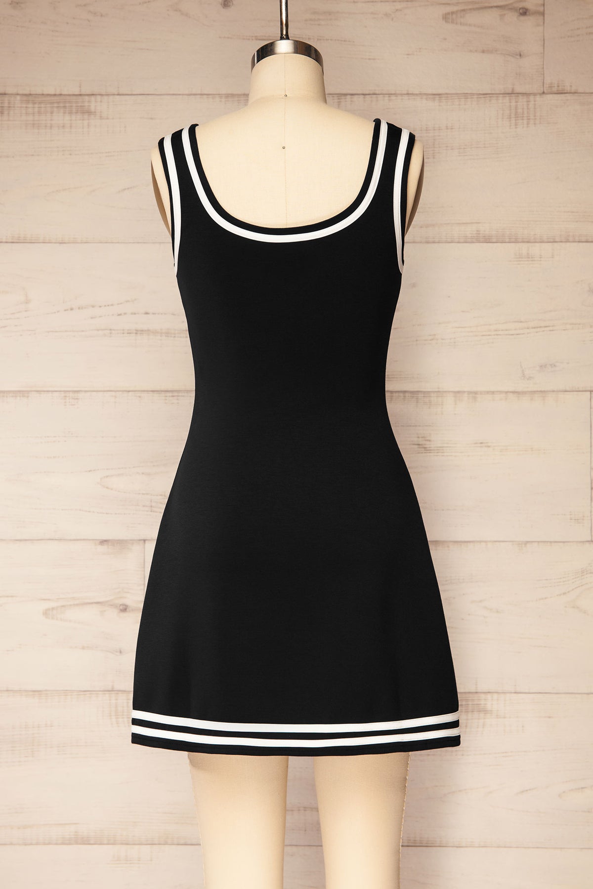 back view of Batala Black Contrast Trim Mini Dress with Built-In Shorts at La petite garçonne