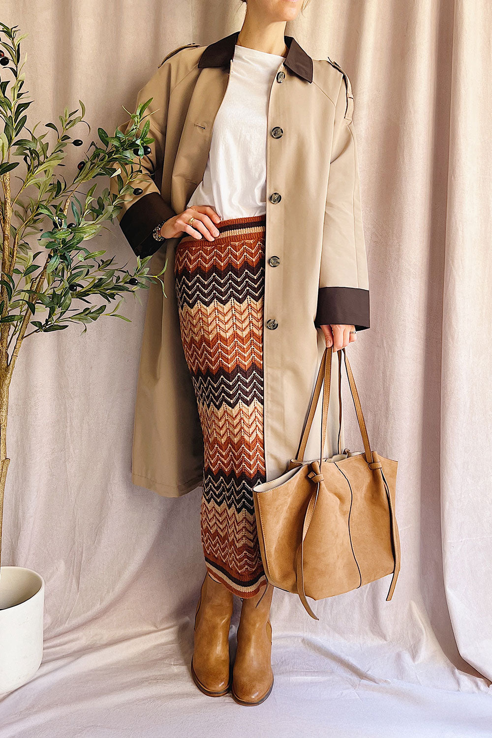 Person wearing Bursa Straight Beige and Brown Coat from La petite garçonne