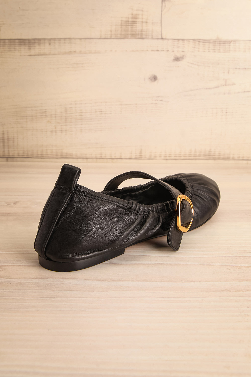 Caelie Black Leather Ballet Flats with Gold Buckle | La petite garçonne back view