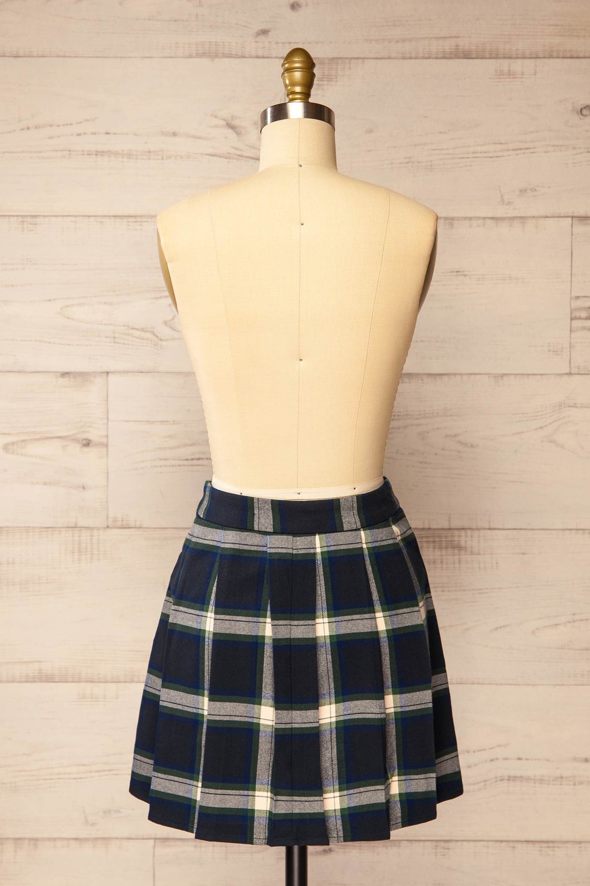 back view of Calenzana Plaid Pleated Mini Skirt at La petite garçonne