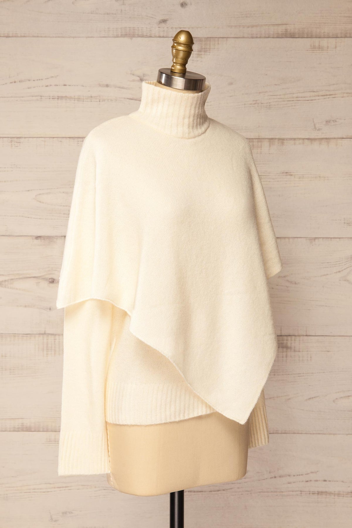 side view of Caplan Ivory Asymmetrical Overlay Knit Sweater at La petite garçonne