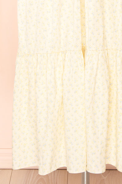 Carolane Maxi Cream Dress w/ Blue Floral Pattern | Boutique 1861 bottom
