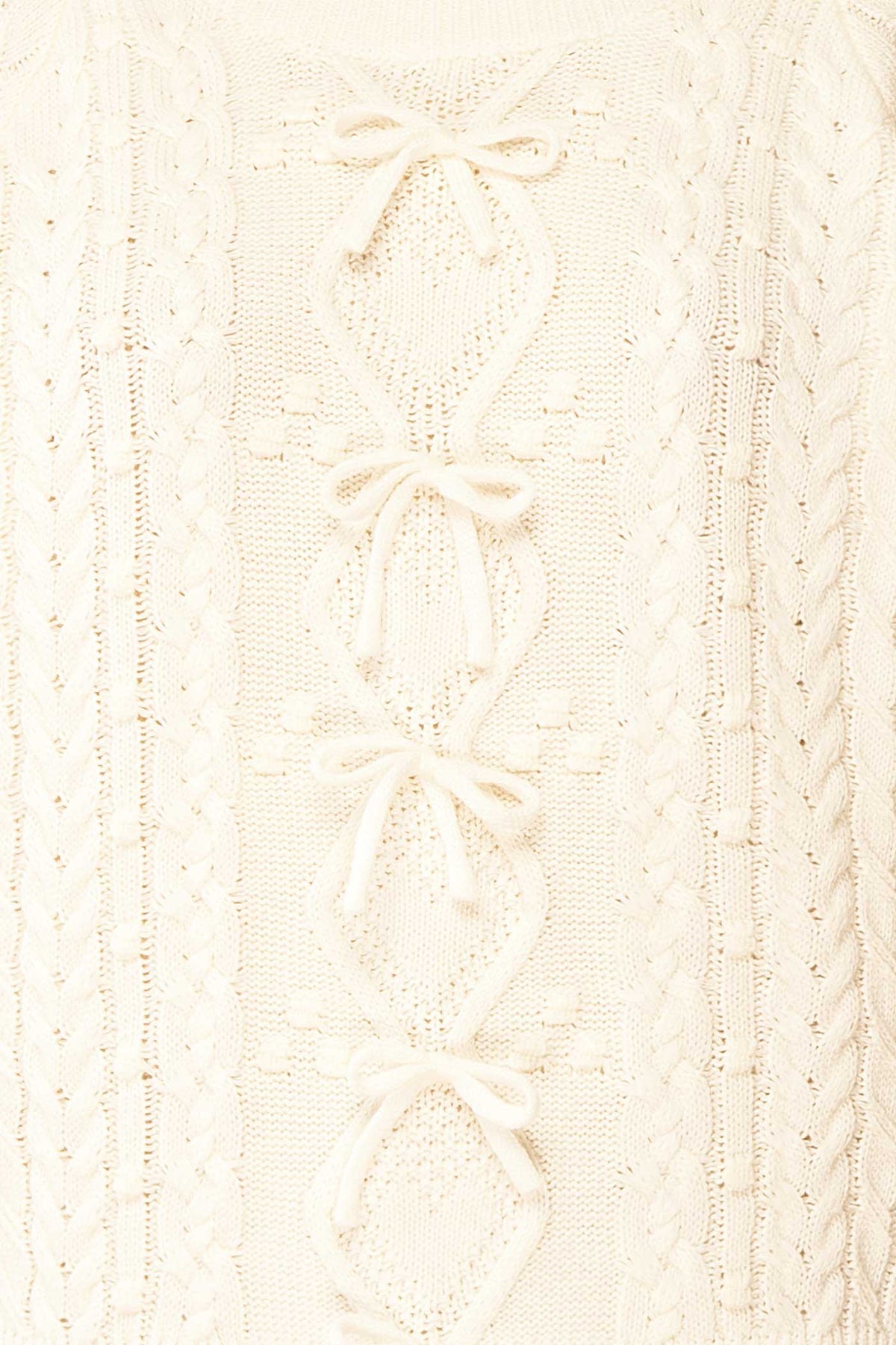 fabric view Celesia Ivory Knit Sweater with Bows at Boutique 1861