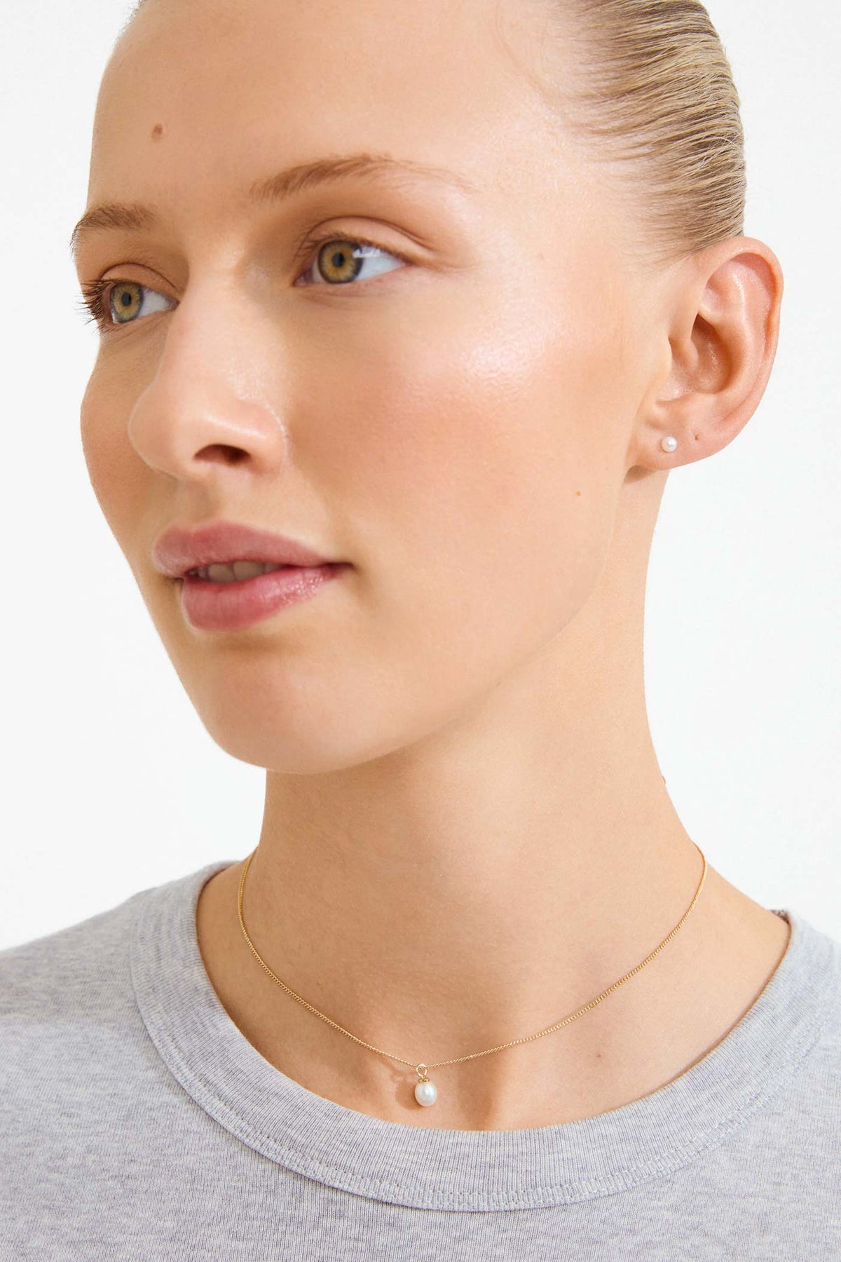 a woman wearing Cidia Gold Pearl Necklace and Earrings Set by Pilgrim from La petite garçonne