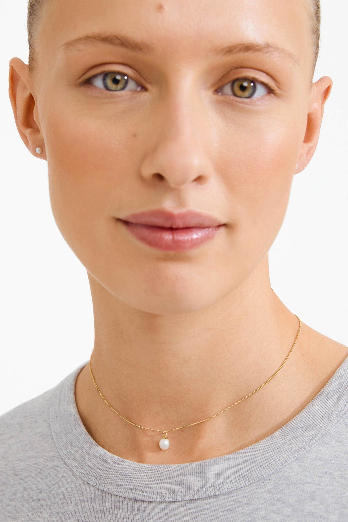 woman wearing Cidia Gold Pearl Necklace and Earrings Set by Pilgrim from La petite garçonne