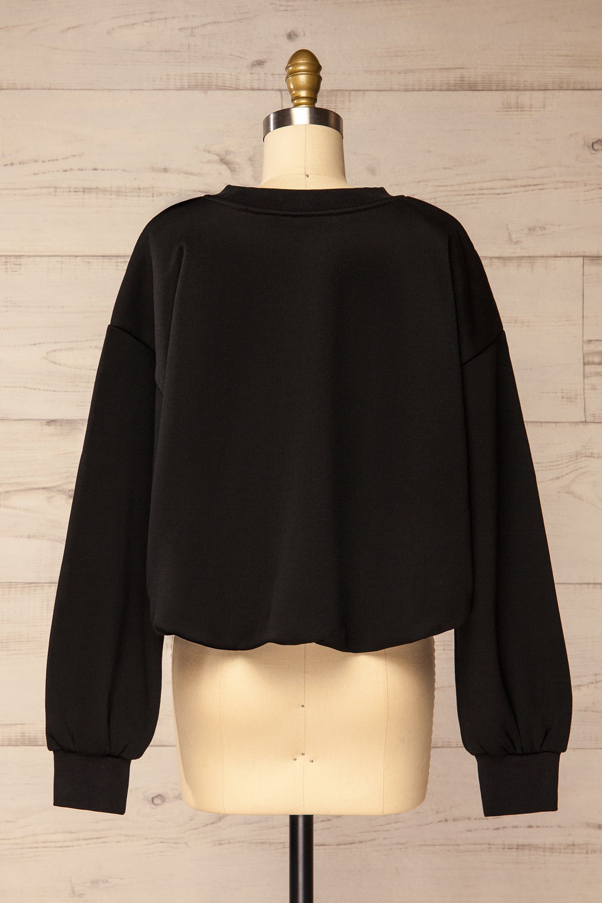 back view of Cobija Black Cropped Sweatshirt with Elastic Hem at La petite garçonne