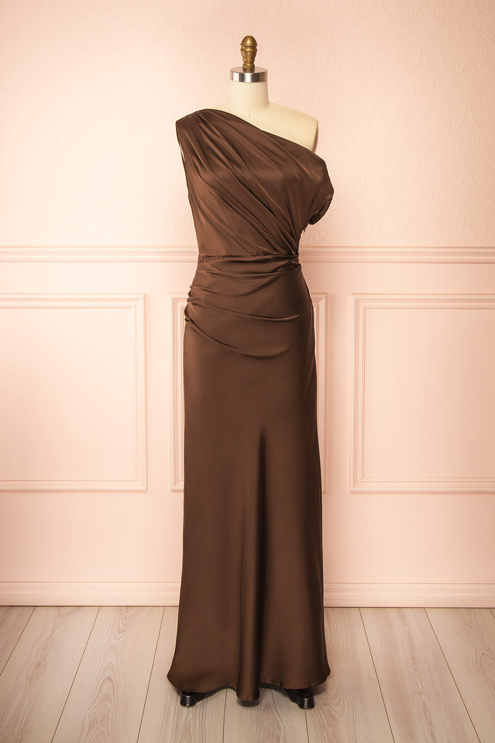 front view of mannequin wearing Colleen Brown Asymmetrical Satin Dress from boutique 1861
