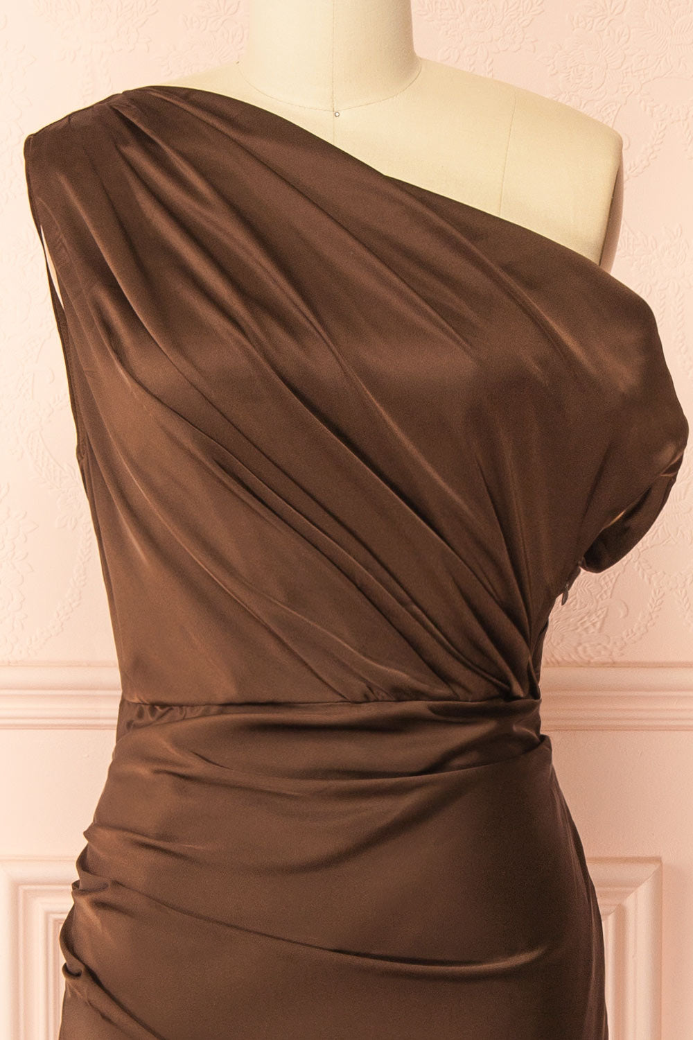 front front view of mannequin wearing Colleen Brown Asymmetrical Satin Dress from boutique 1861
