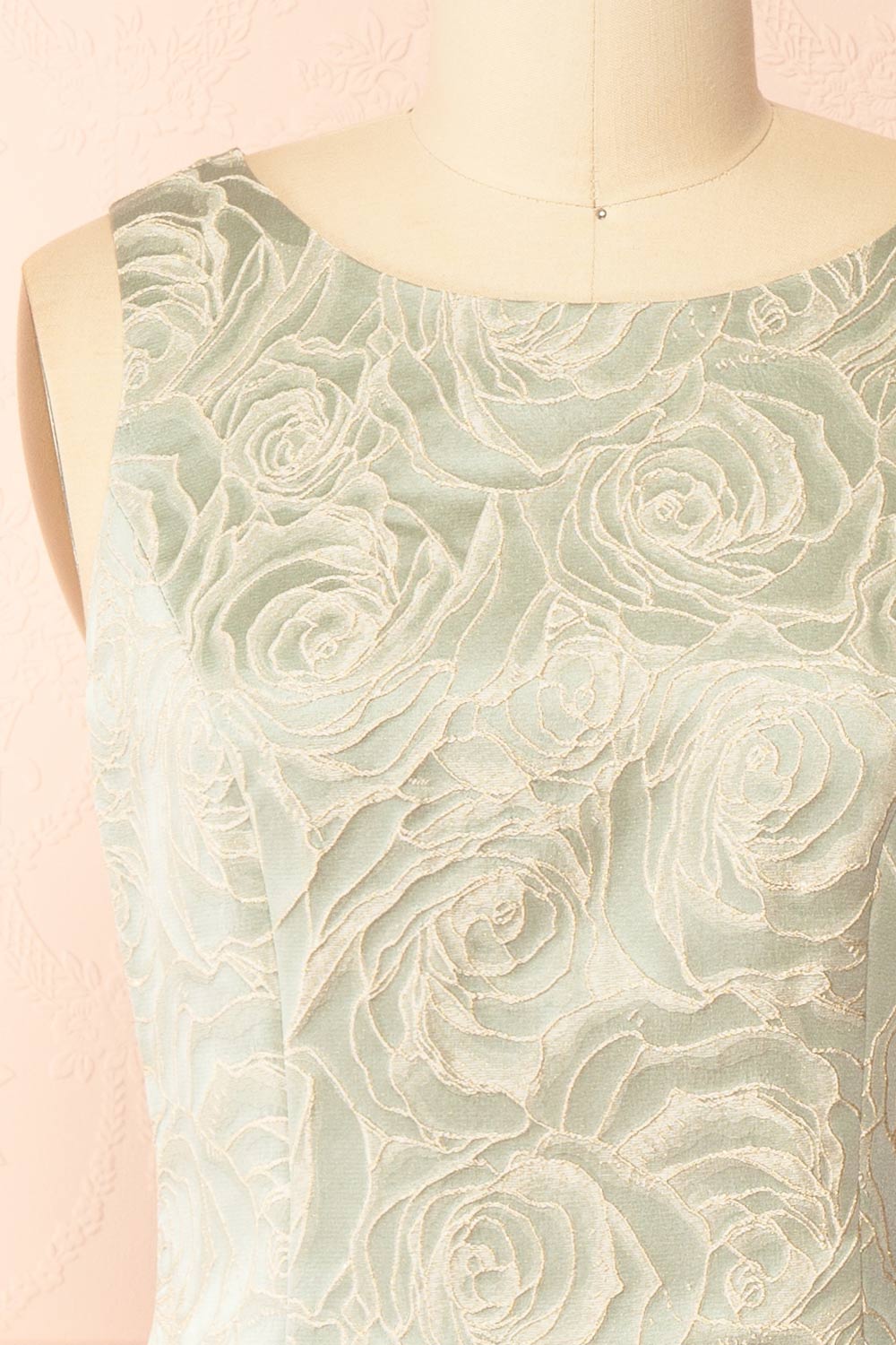 front of a mannequin wearing a Daenna Sage Short Floral Embroidered Dress from boutique 1861