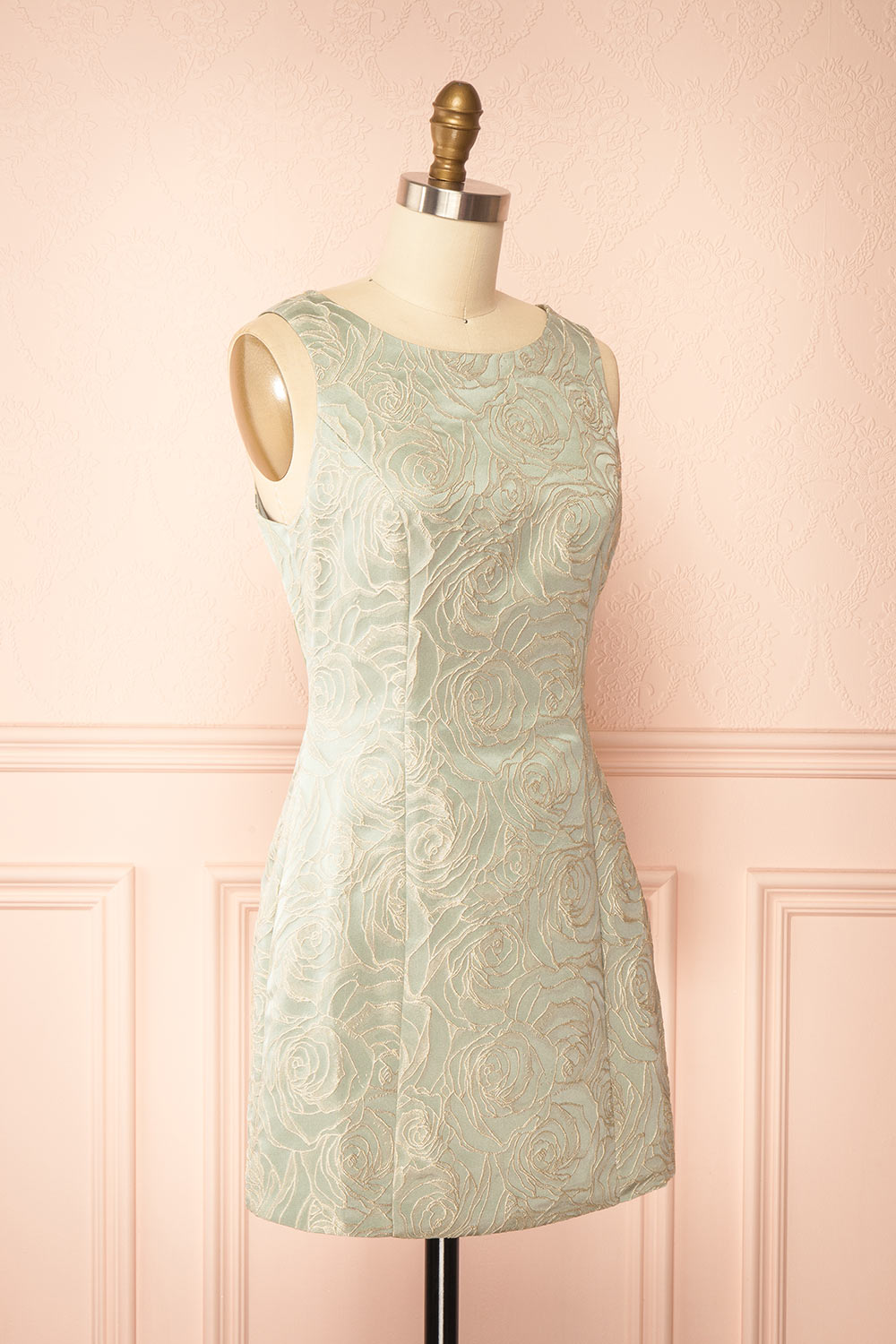 side view of a mannequin wearing a Daenna Sage Short Floral Embroidered Dress from boutique 1861