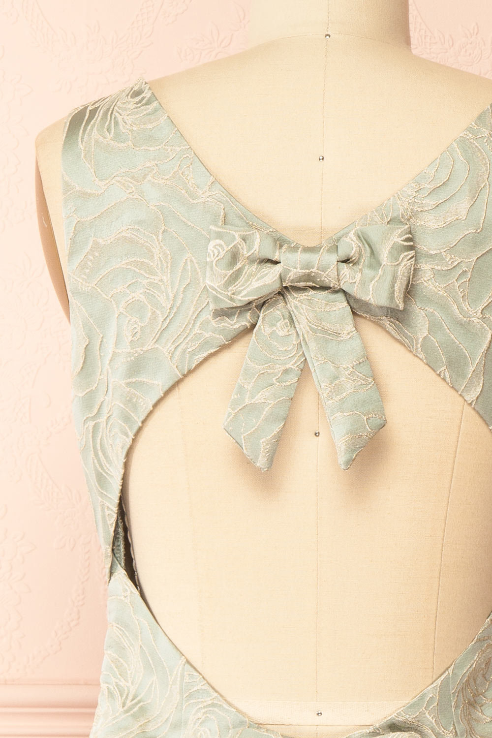 back of a mannequin wearing a Daenna Sage Short Floral Embroidered Dress from boutique 1861