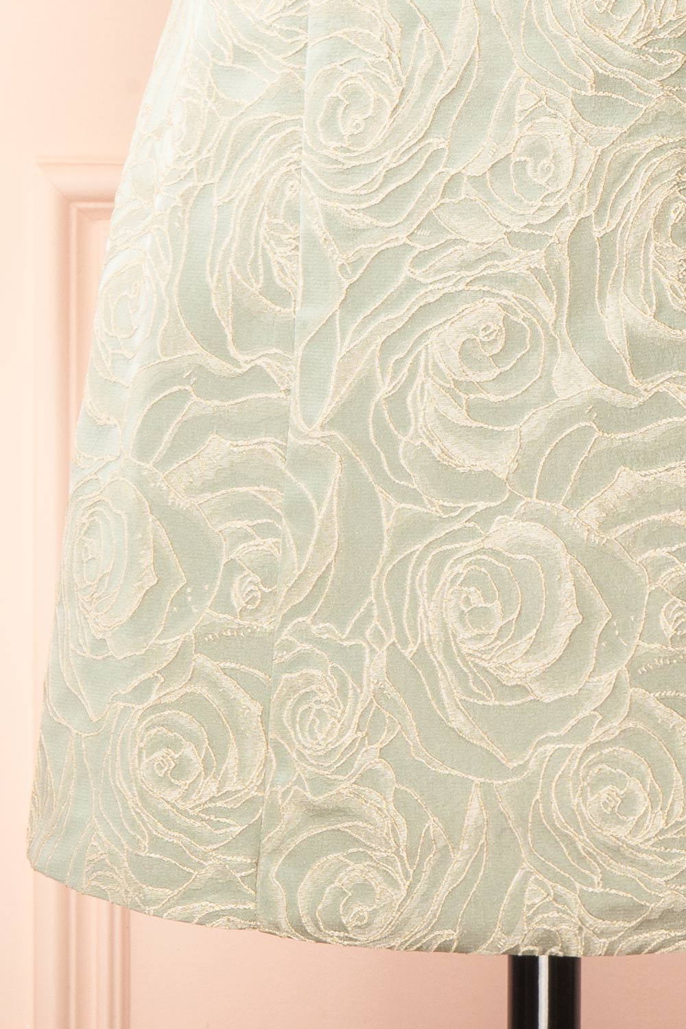 bottom of a mannequin wearing a Daenna Sage Short Floral Embroidered Dress from boutique 1861