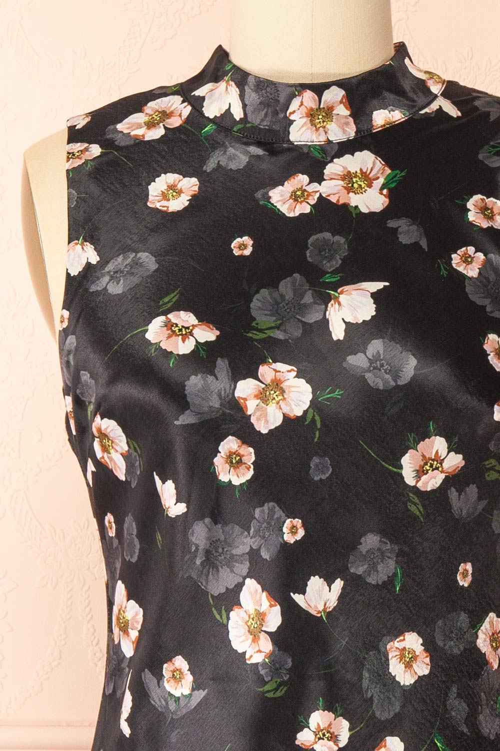 front of sewing mannequin wearing Dalilah Short Floral Dress with Open Back from Boutique 1861