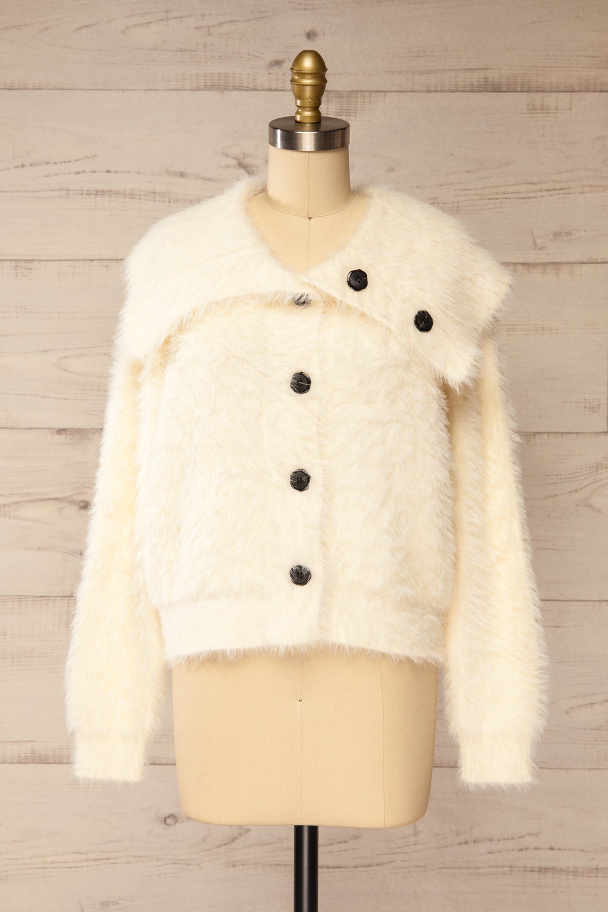 front view of Dassylva Ivory Fluffy Cardigan with Contrast Buttons at La petite garçonne