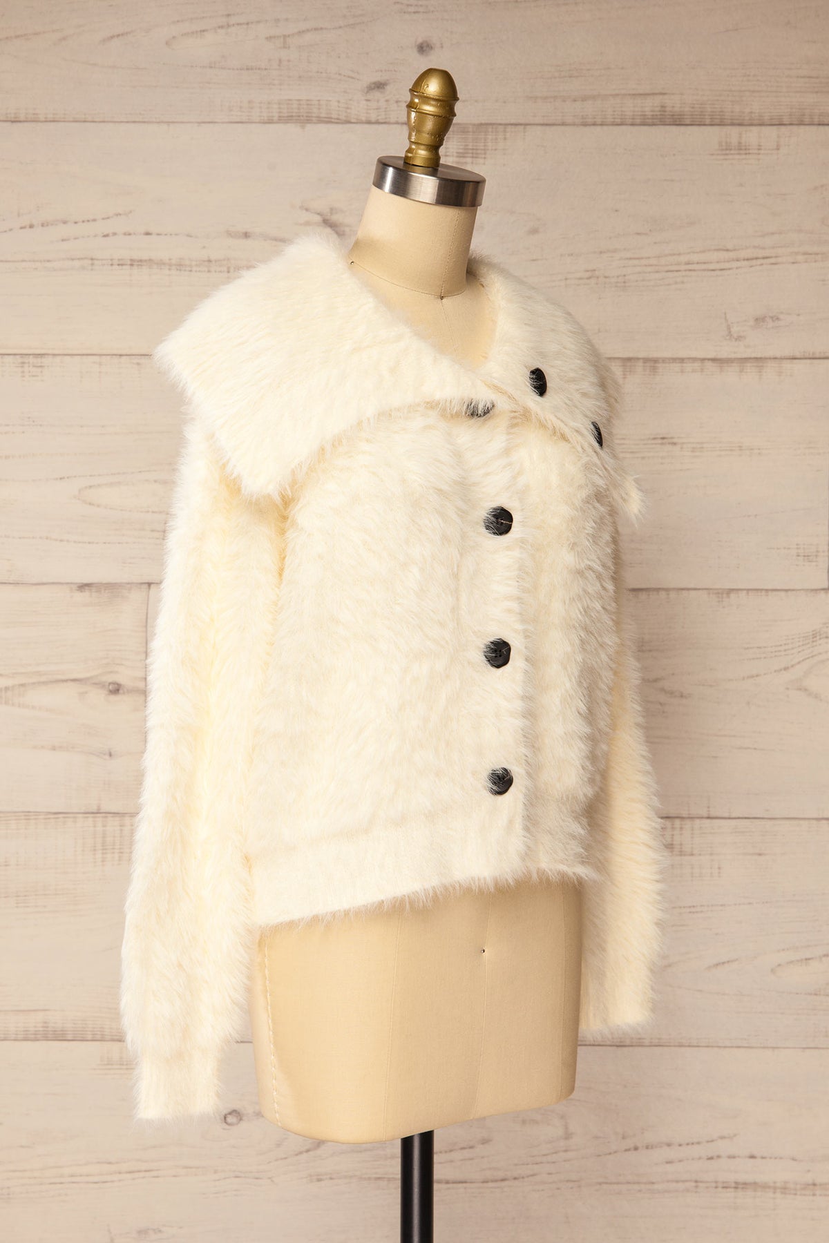 side view of Dassylva Ivory Fluffy Cardigan with Contrast Buttons at La petite garçonne