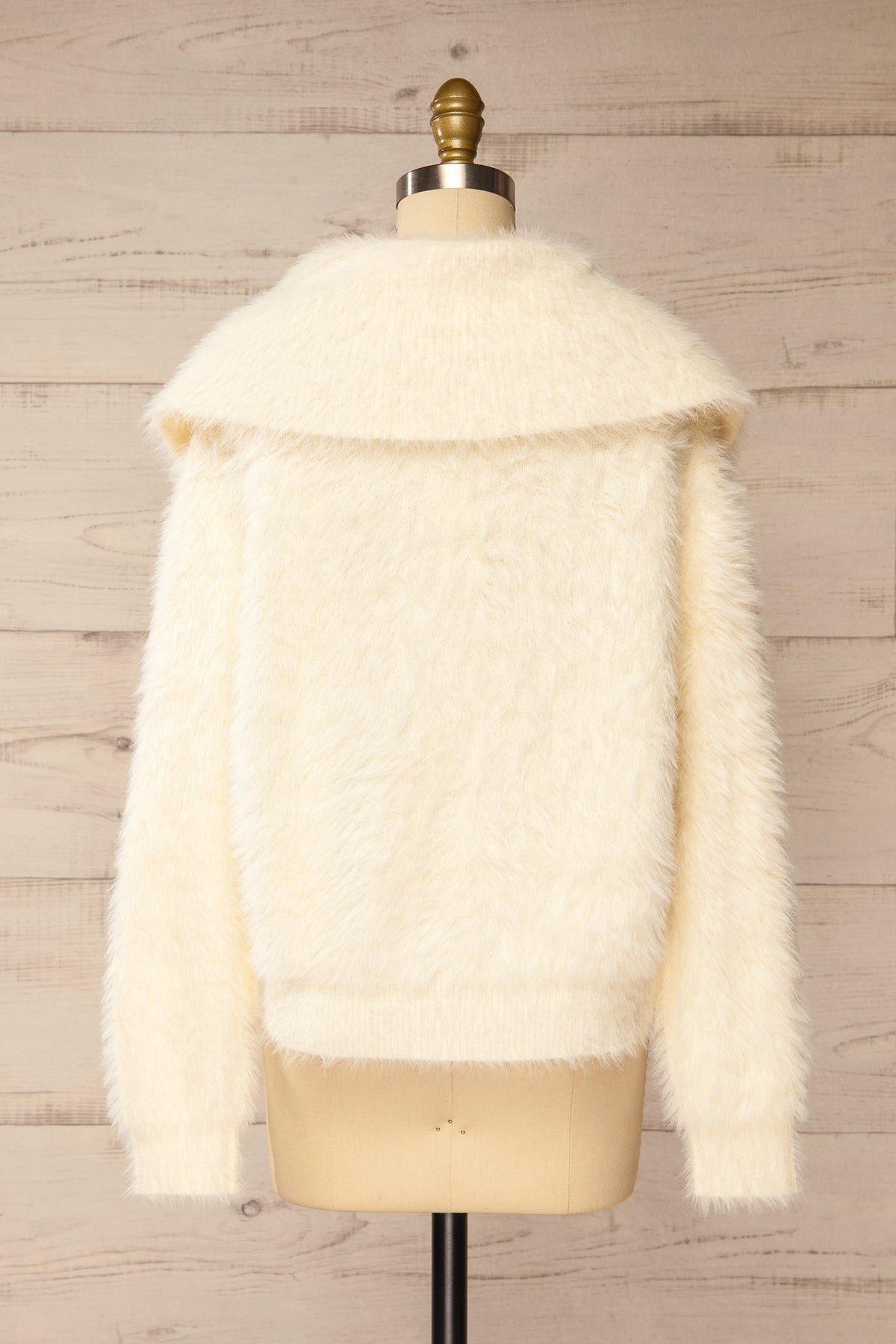 back view of Dassylva Ivory Fluffy Cardigan with Contrast Buttons at La petite garçonne