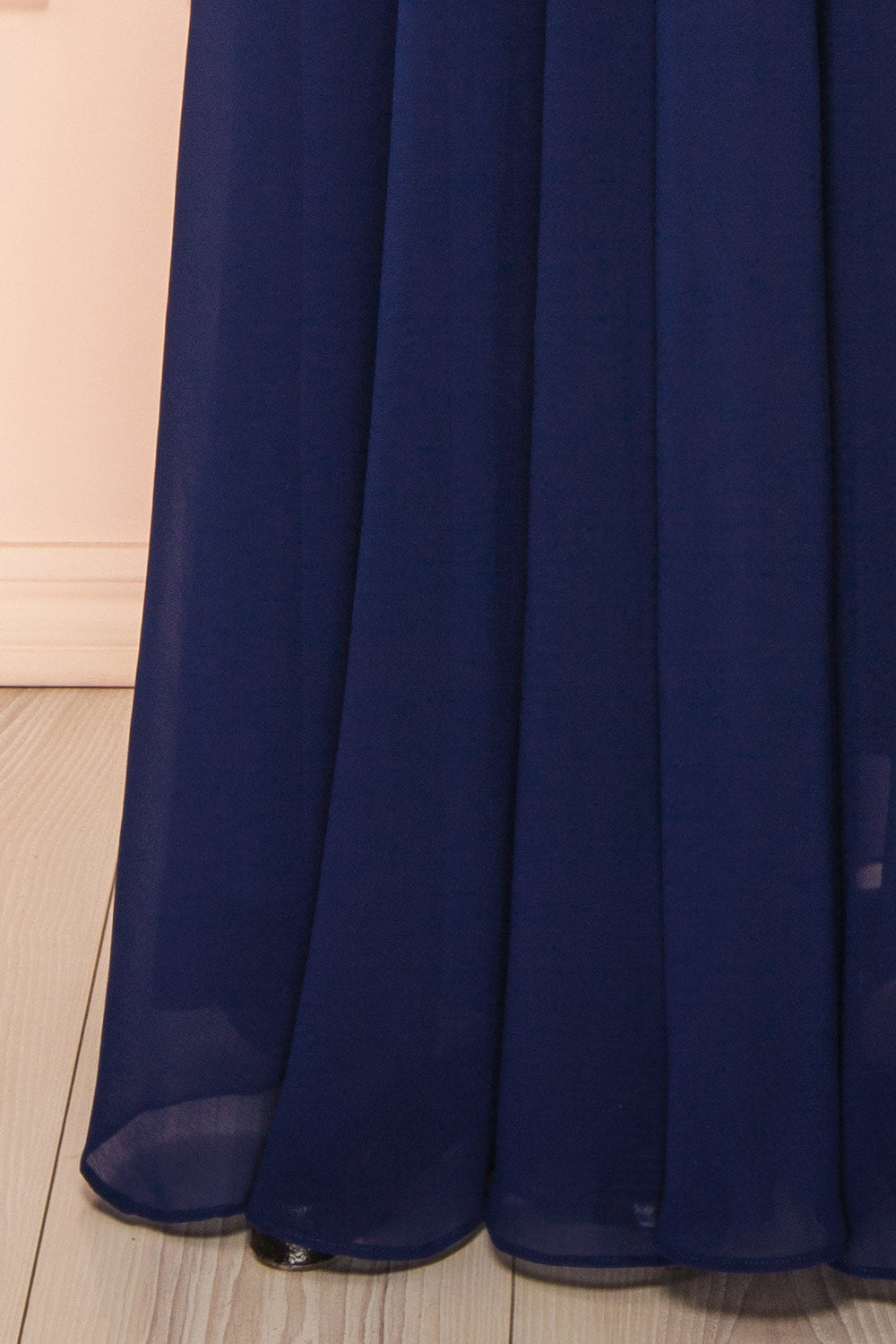 bottom of mannequin wearing Diana Navy Exclusive 1861 A-Line Chiffon Dress with Slit from Boutique 1861