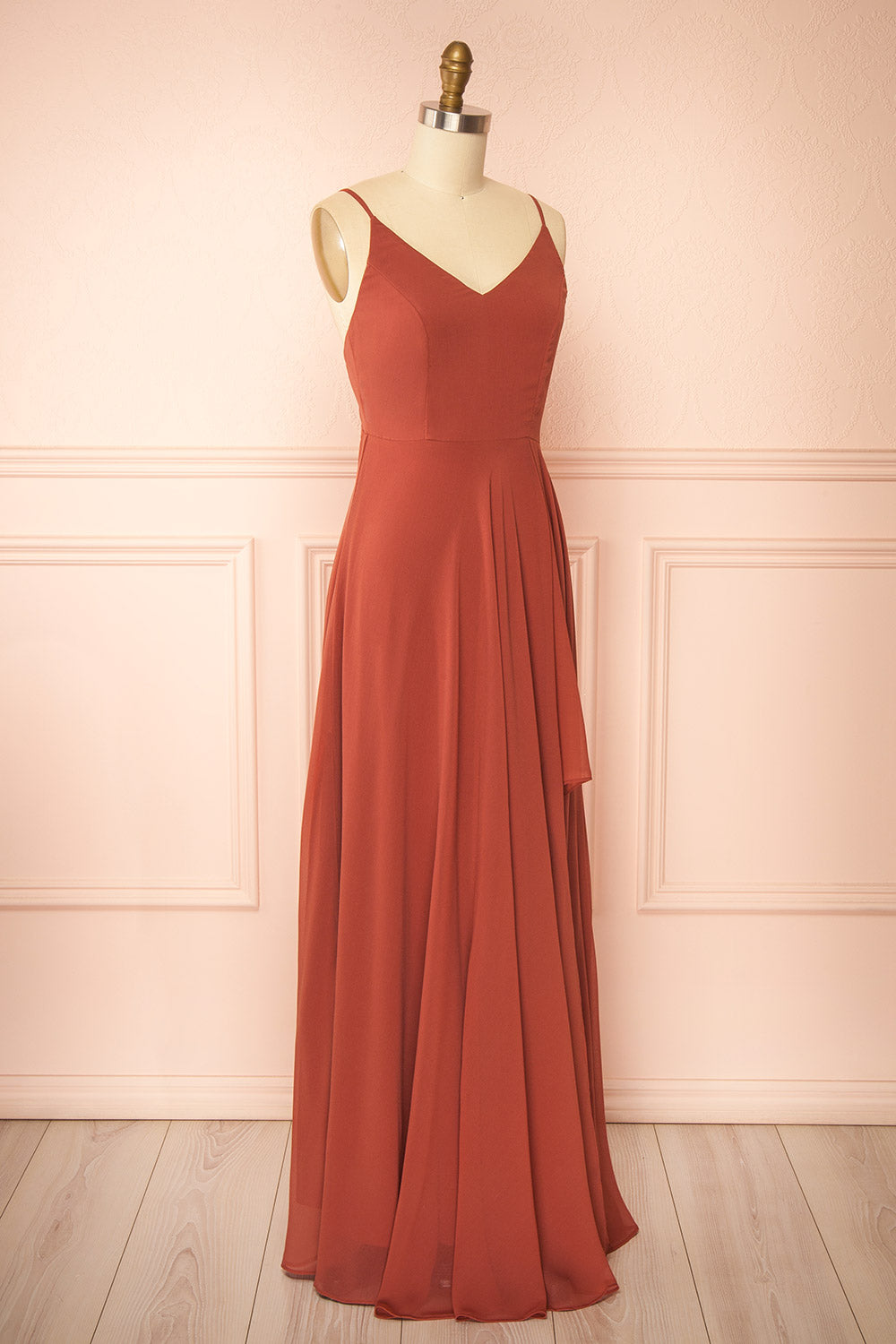 side view of a mannequin wearing Diana Rust Exclusive 1861 A-Line Chiffon Dress with Slit | Boutique 1861