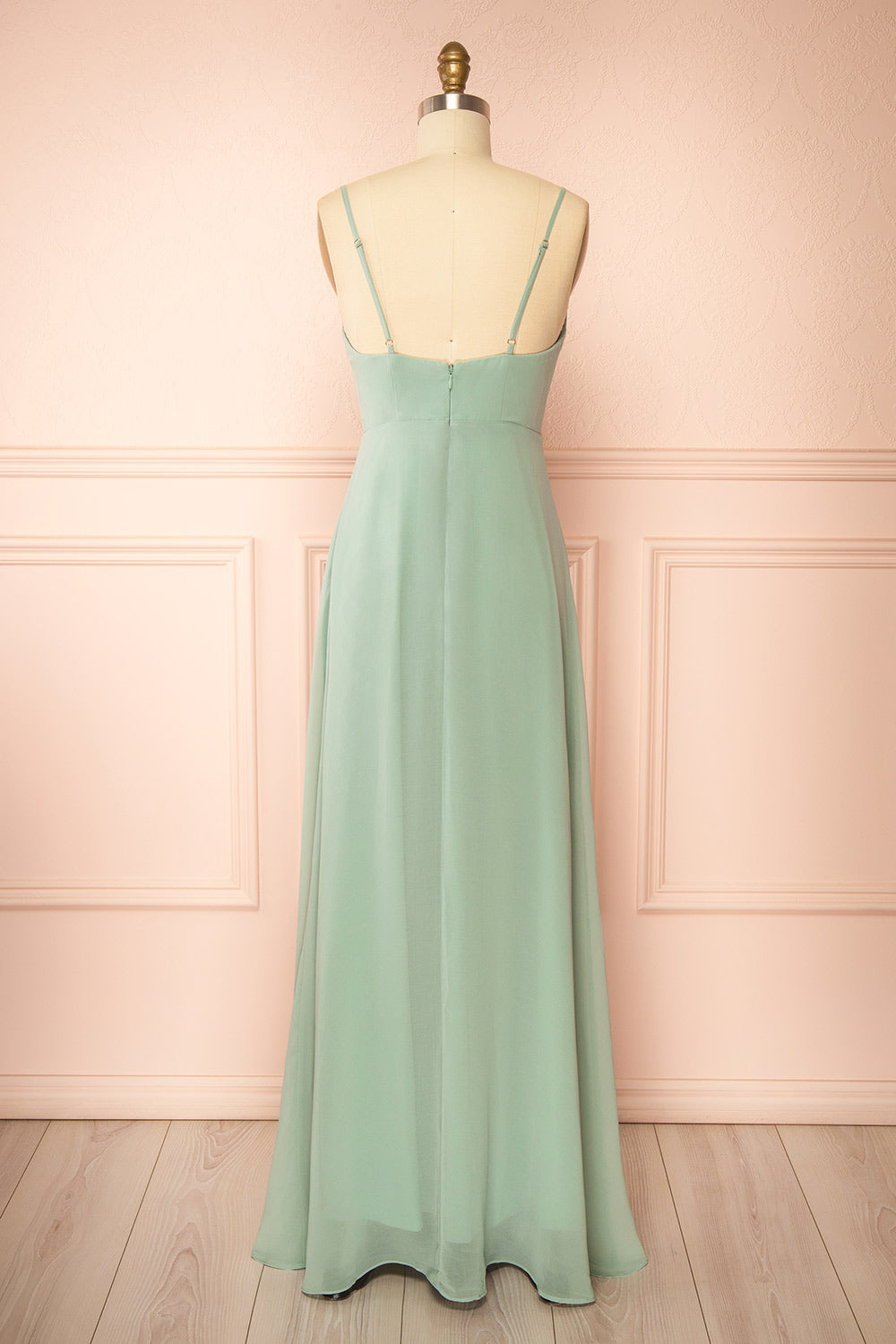 back view of a mannequin wearing Diana Rust Exclusive 1861 A-Line Chiffon Dress with Slit | Boutique 1861