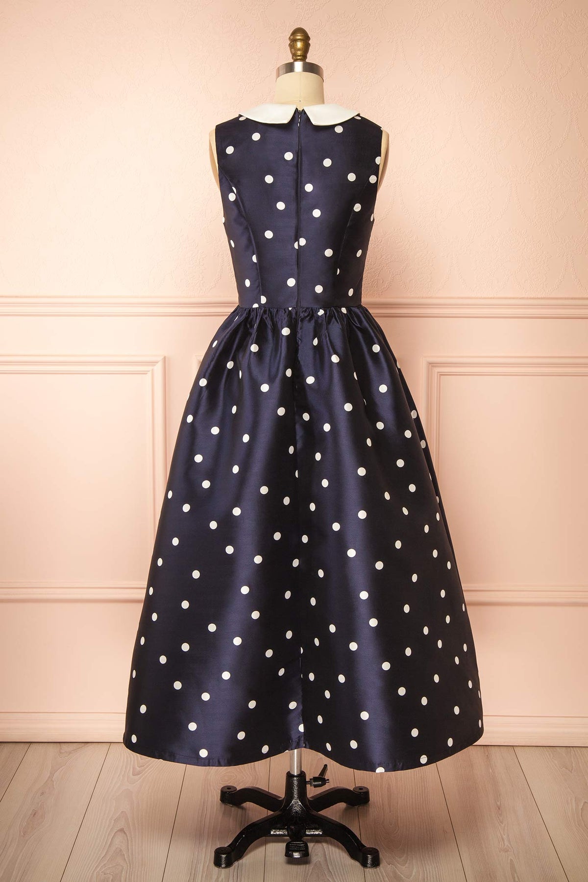 back view of Dollie Midi Navy Polka Dot Dress with Peter Pan Collar at Boutique 1861