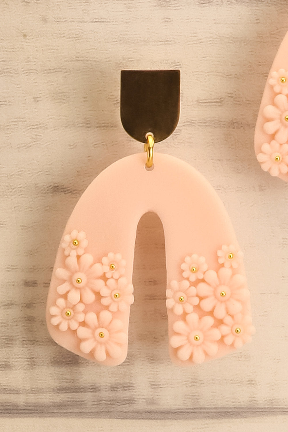 Dorothée Blush U Shaped Pendant Earrings with Floral Detail from La petite garçonne close-up