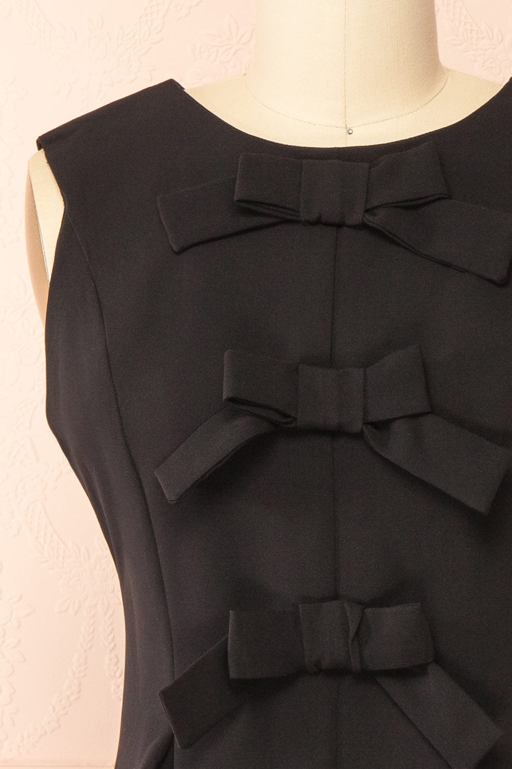 Dounia Short Sleeveless Black Dress with Bows | Boutique 1861 front