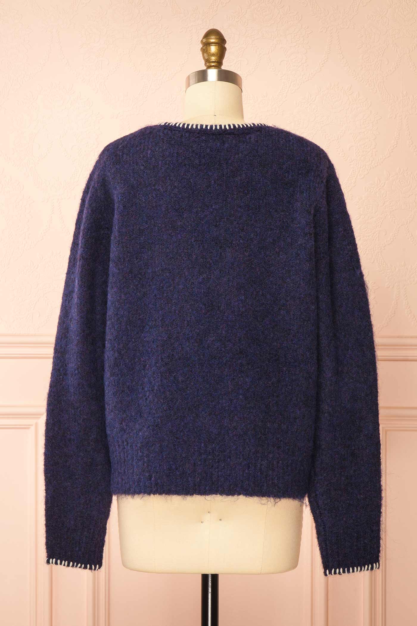 back view of Edulia Navy Knit Cardigan with Floral Embroidery at La petite garçonne
