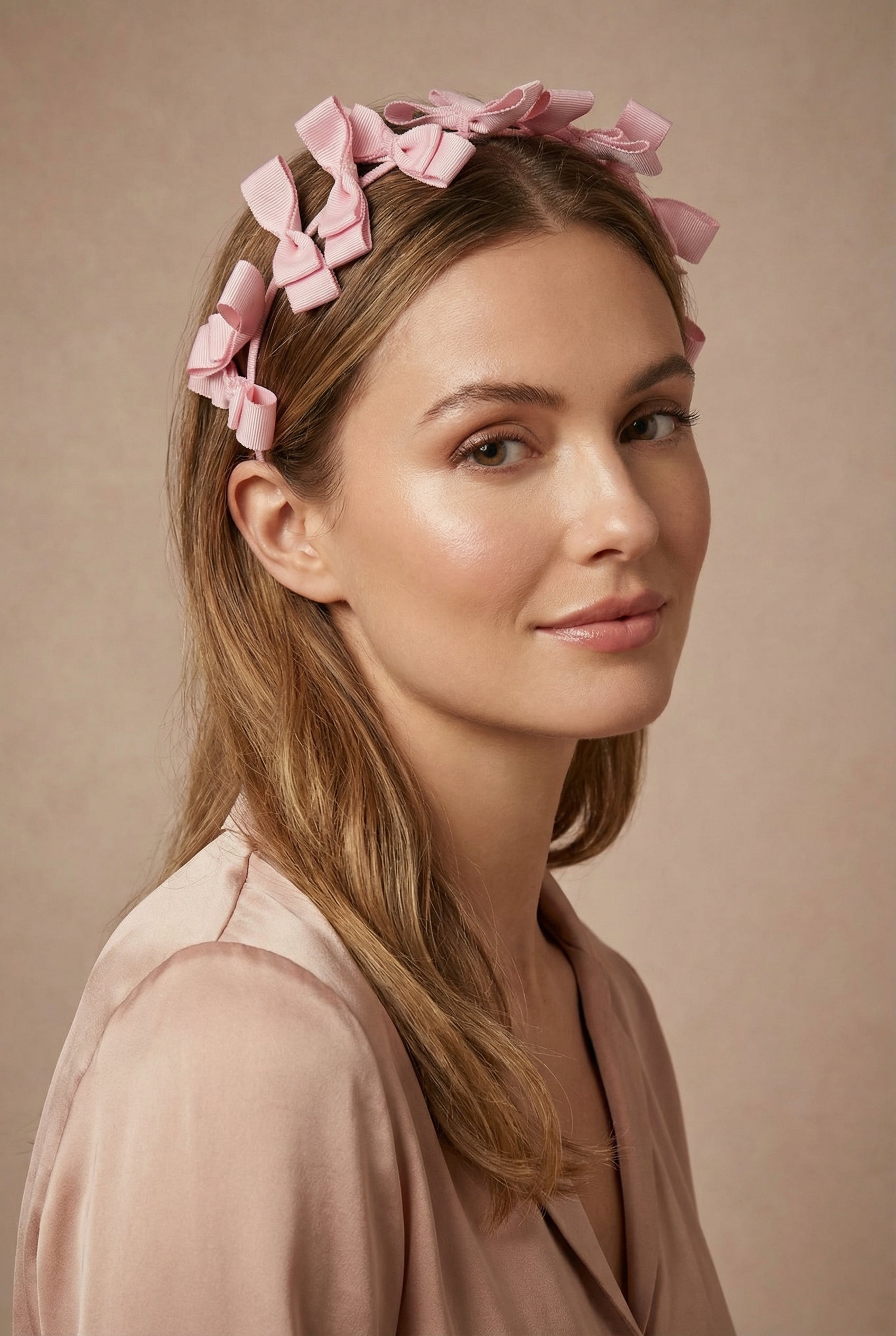 woman wearing Elite Pink Thin Headband w/ Bows from Boutique 1861